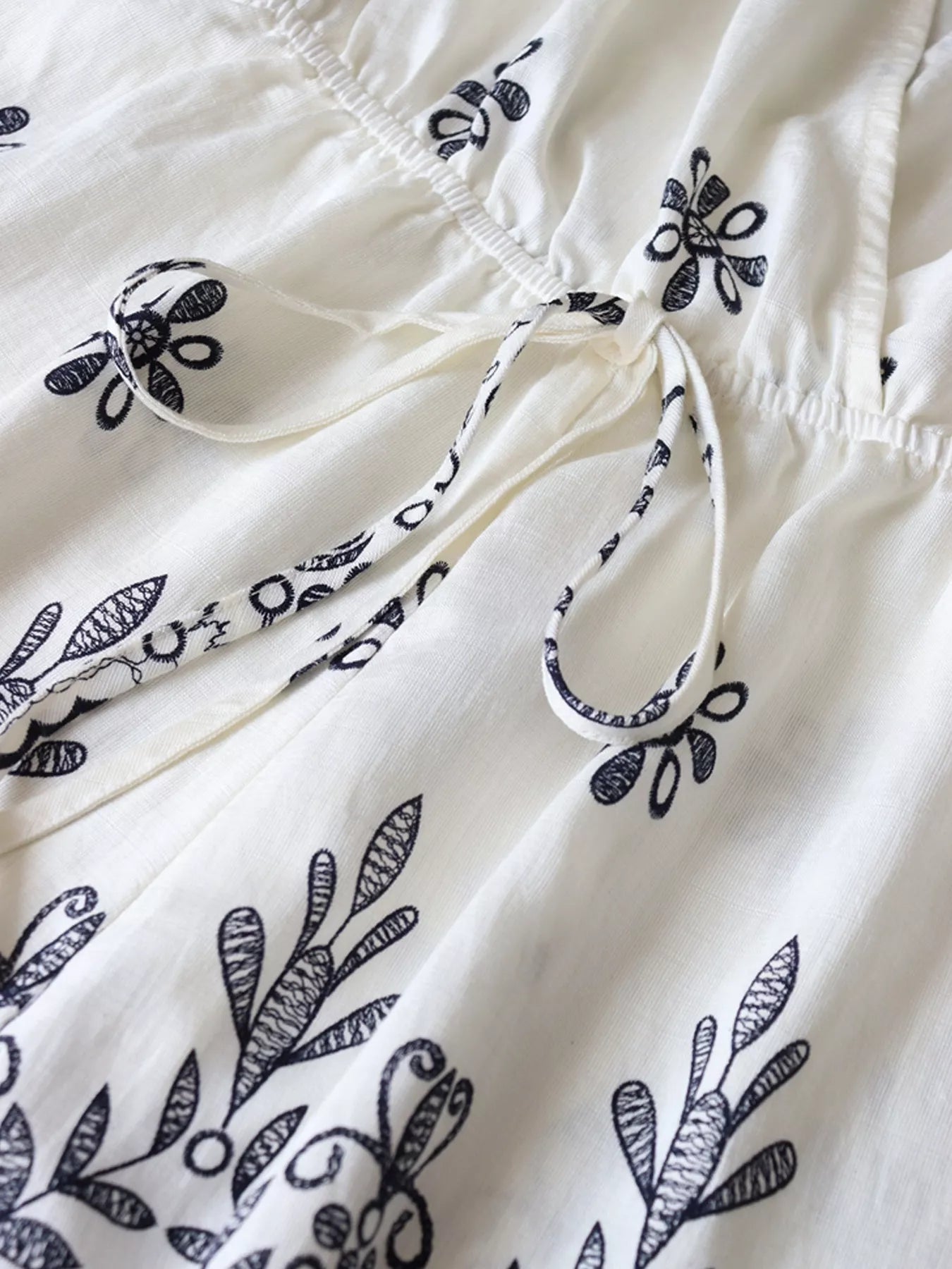 Trendsi Printed Surplice Half Sleeve Romper -