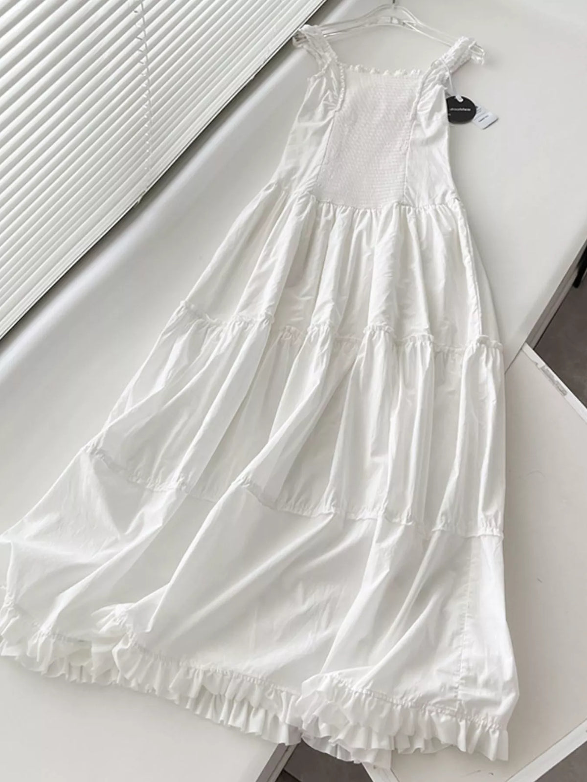 Women's Ruffled Square Neck Tiered Maxi Dress in white — flat lay view