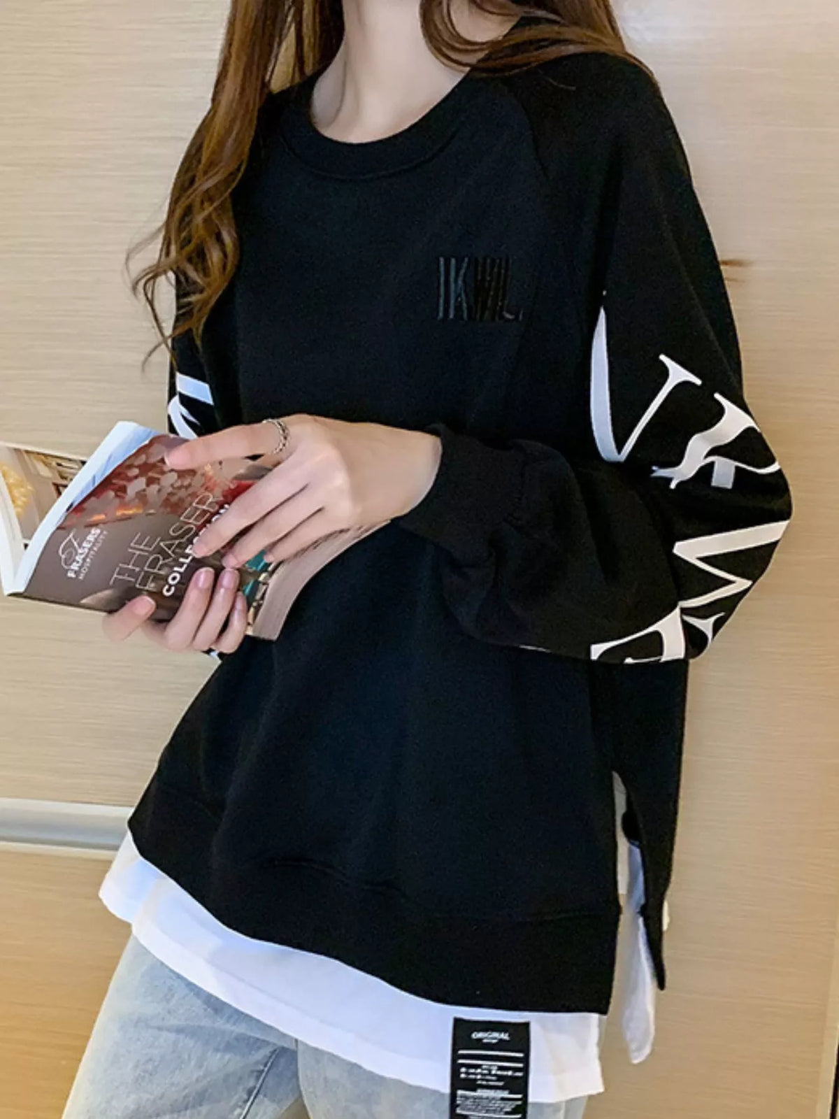 Black layered-hem sweatshirt with graphic sleeve detail
