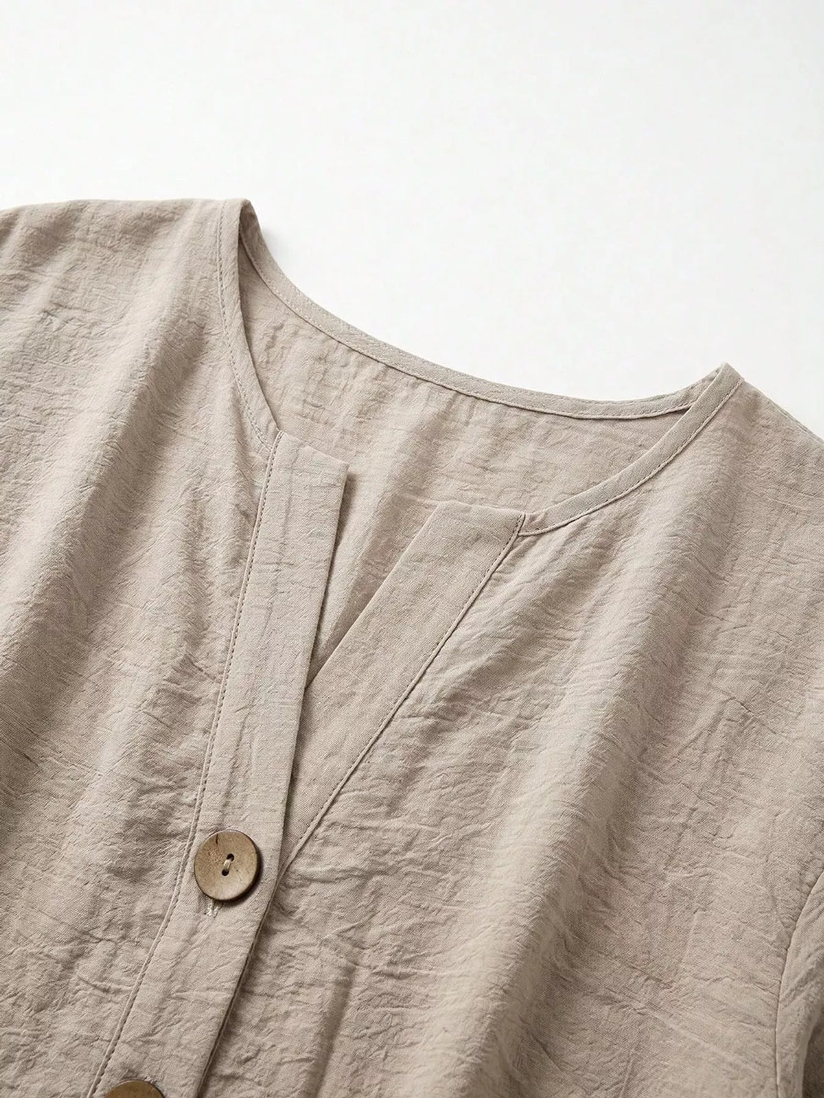 Notched-neck shirt, taupe neckline button cuff and hem details