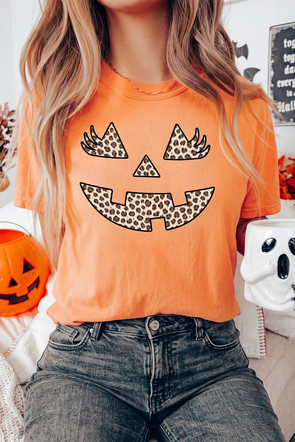 Women's Halloween Pumpkin Face Leopard Graphic T-Shirt in Orange, side view