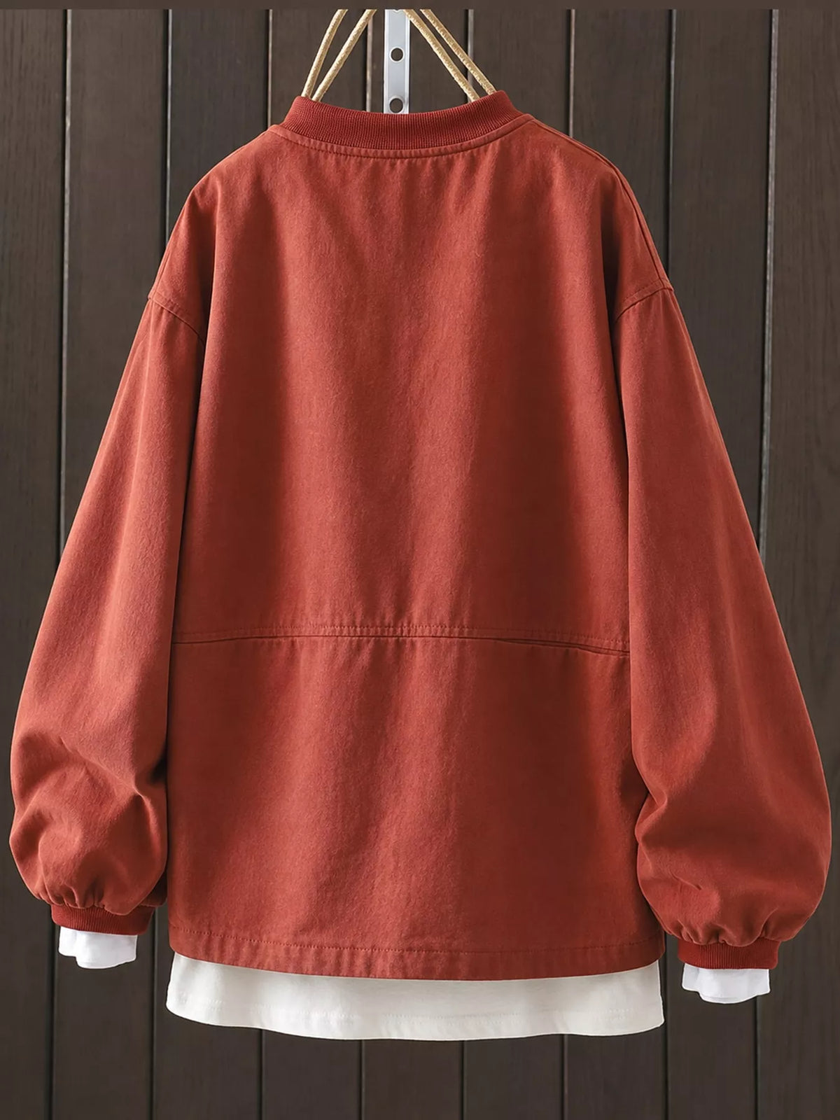 Rust red snap front dropped shoulder jacket, back view