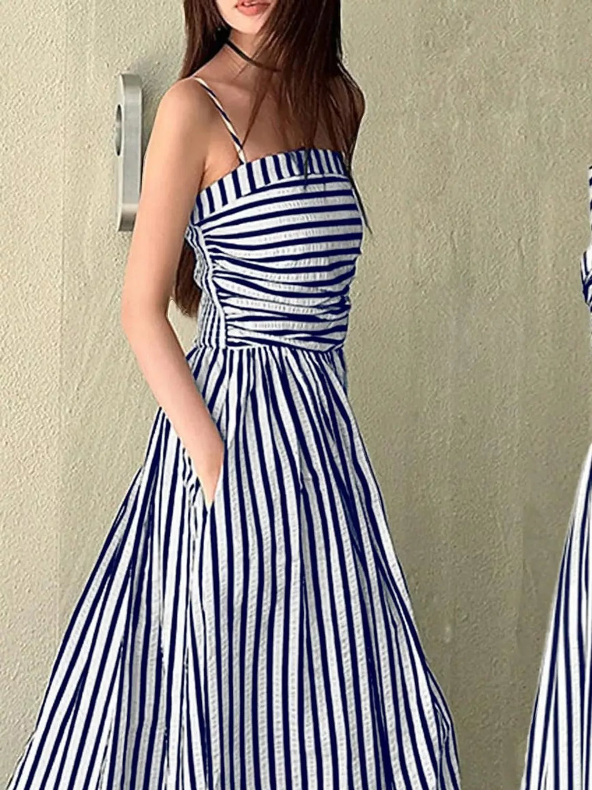 Navy and white striped spaghetti strap maxi dress with gathered bodice and pockets