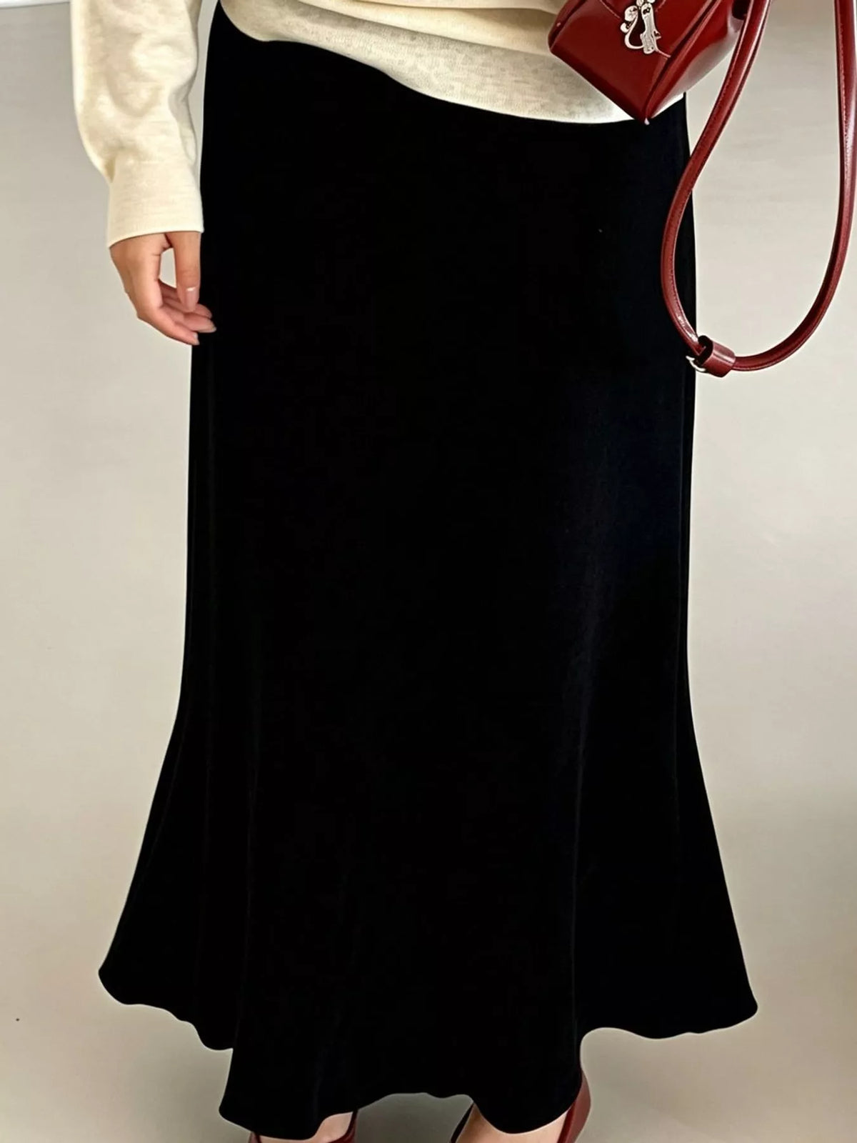 Black high-waisted flared skirt