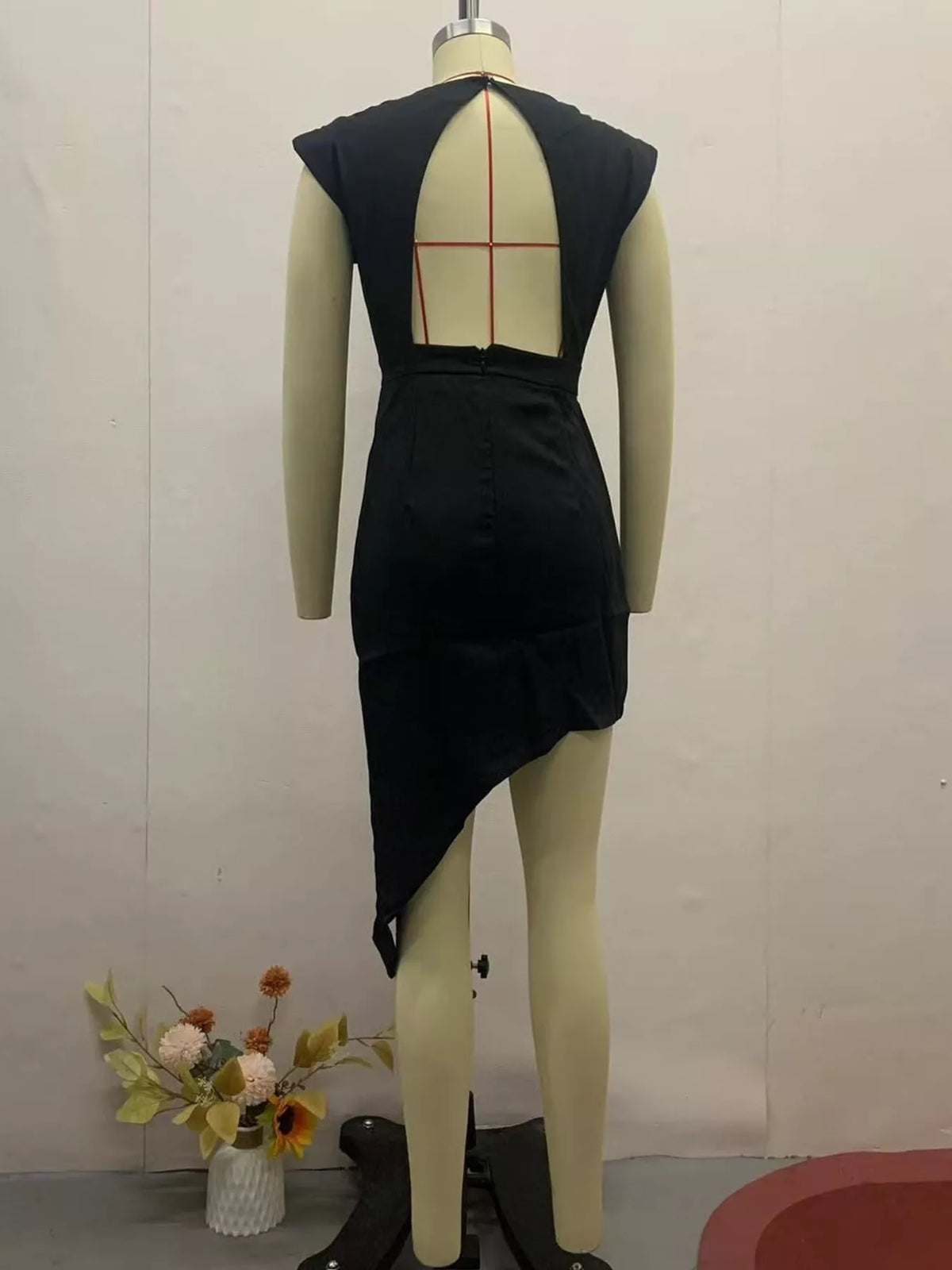 Women's Asymmetrical Backless Pleated Dress in black — mannequin back view