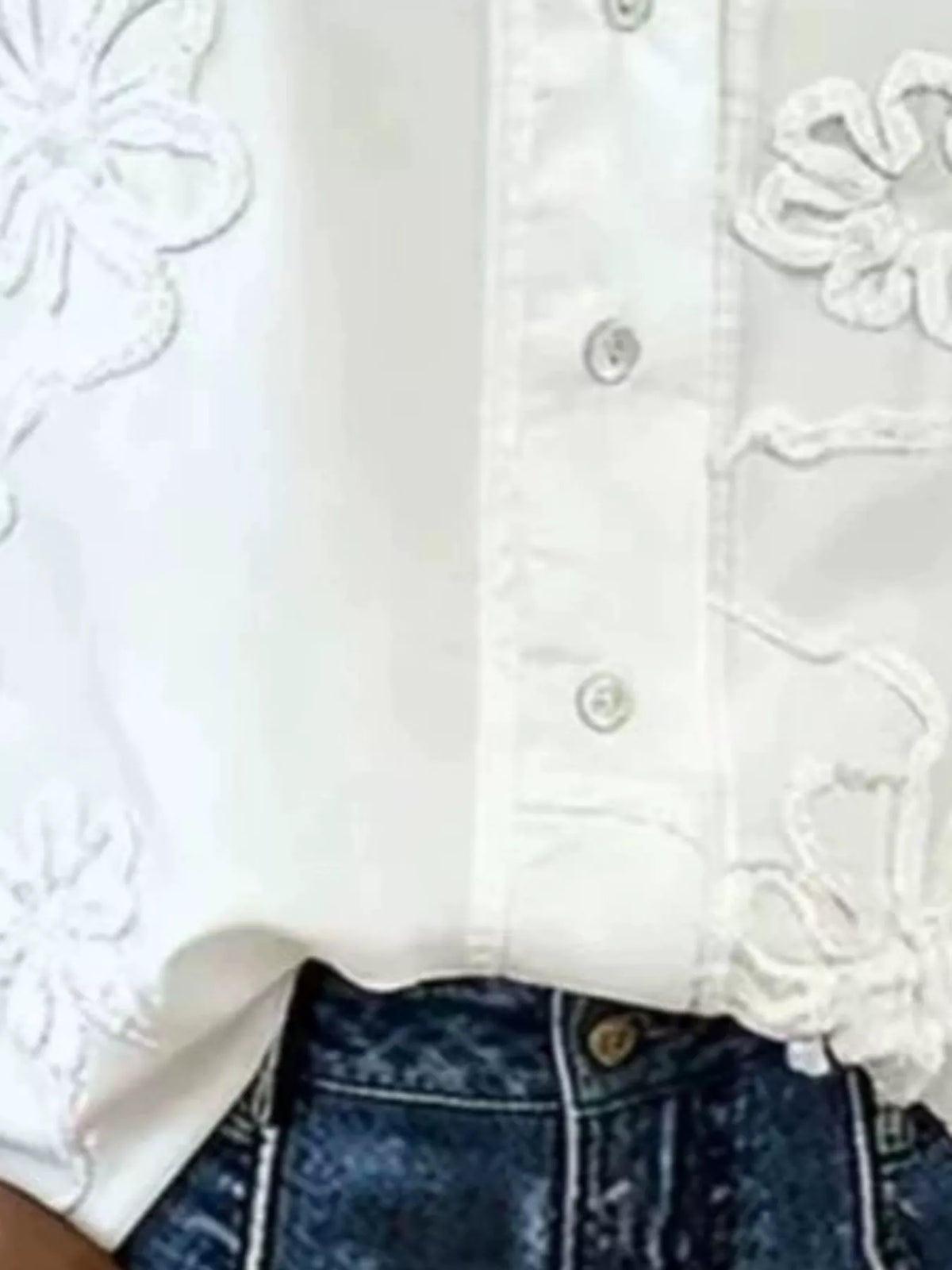 White floral embroidered ruffle v neck blouse, detail view