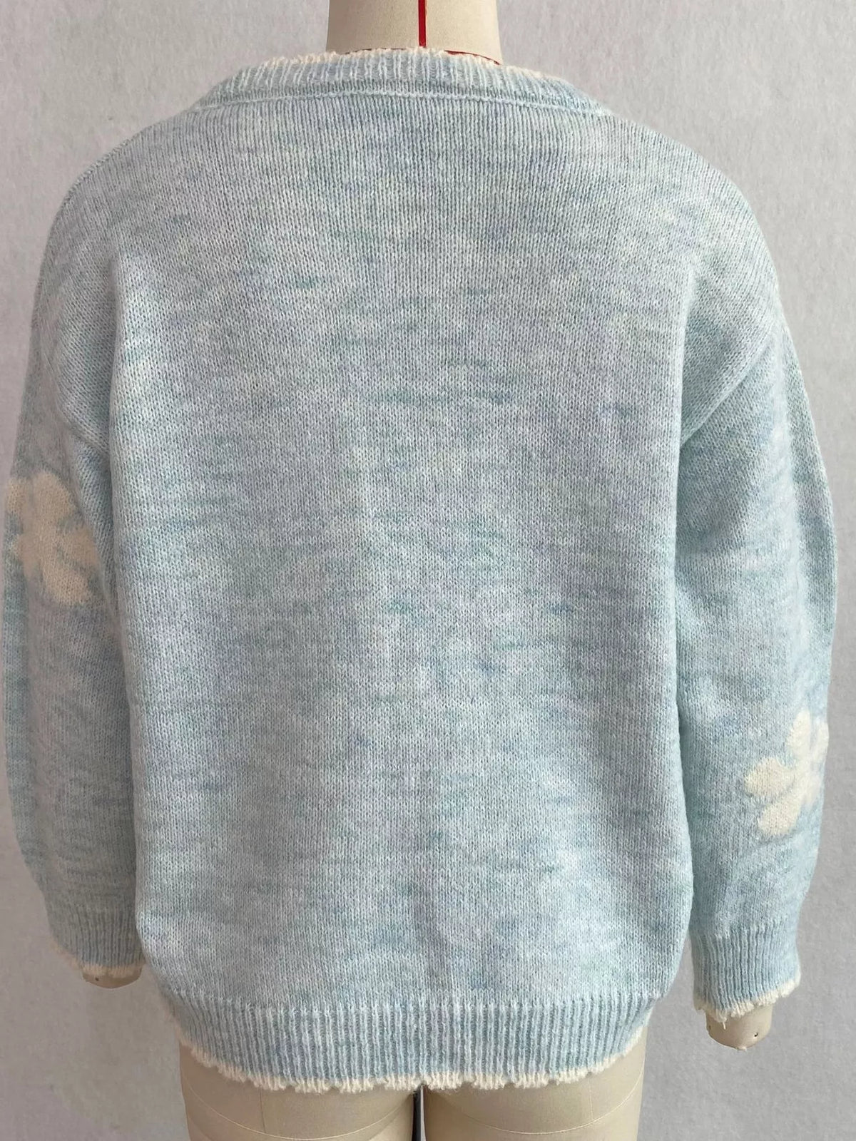 Floral-applique knit cardigan in light blue, mannequin back view