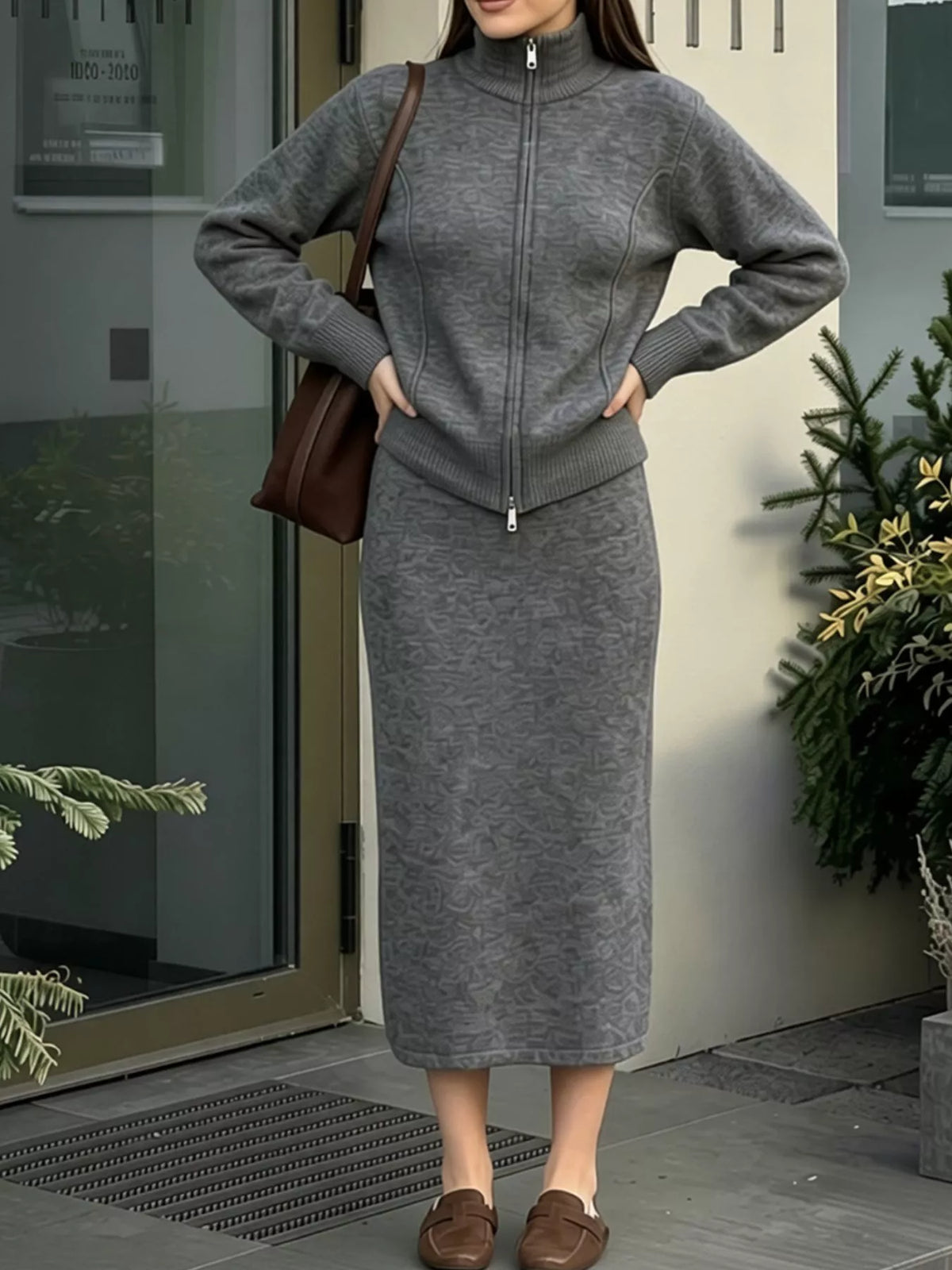 Zip-up cardigan and midi skirt knit set in dark gray, waist detail on model