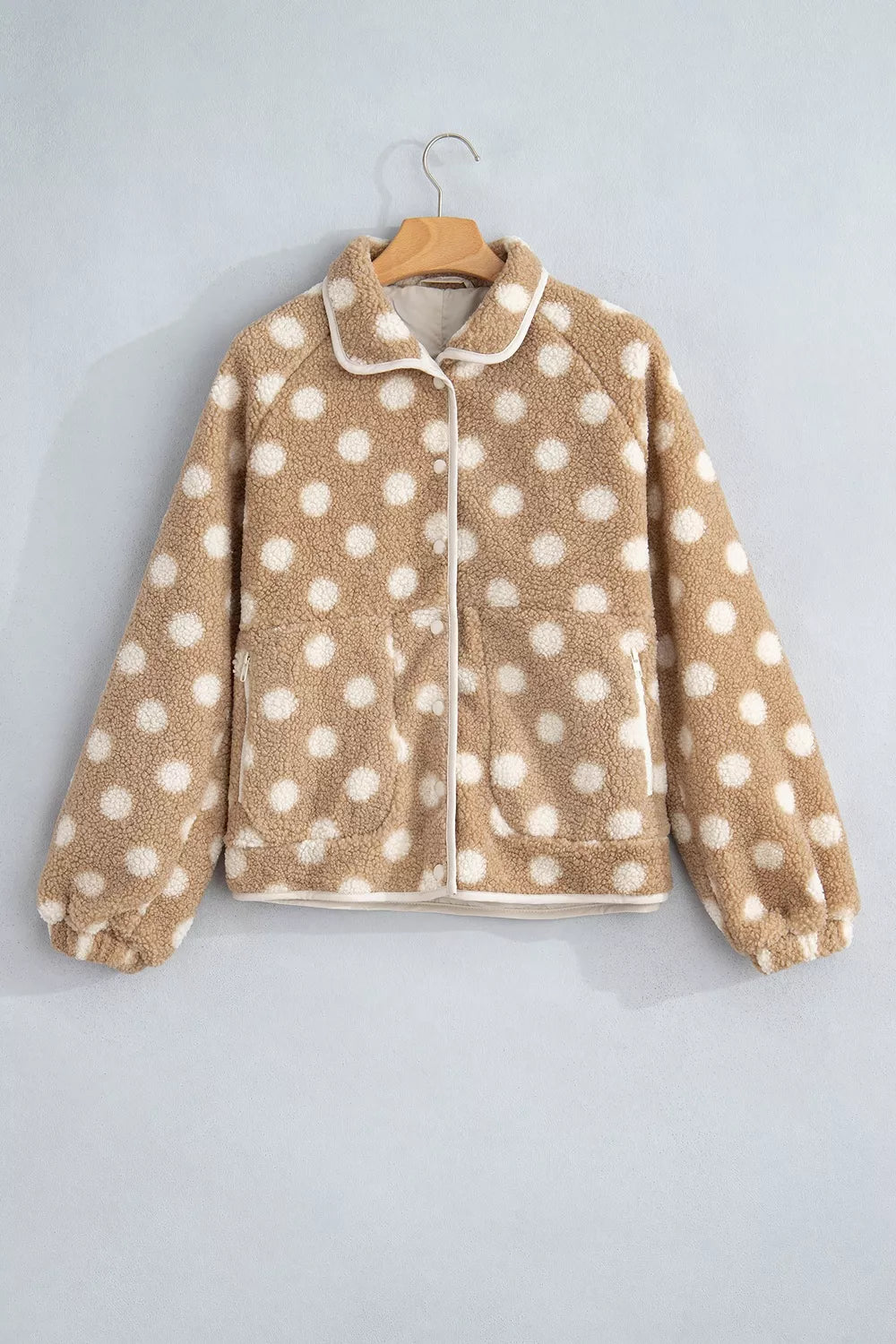 Tan and white polka dot faux fur button-front jacket with zip pockets, front product view