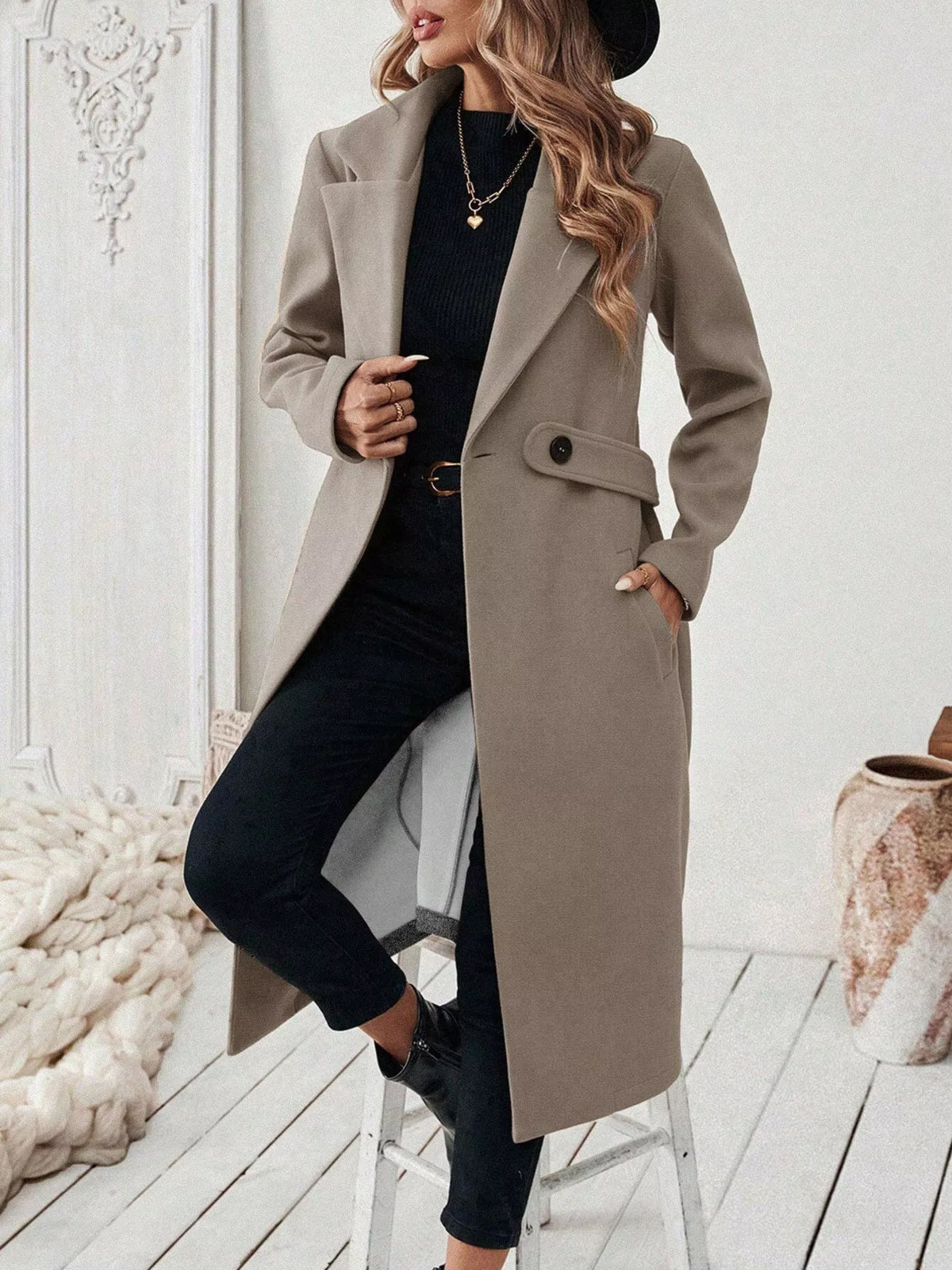Taupe lapel-collar longline coat, open front, knee bent