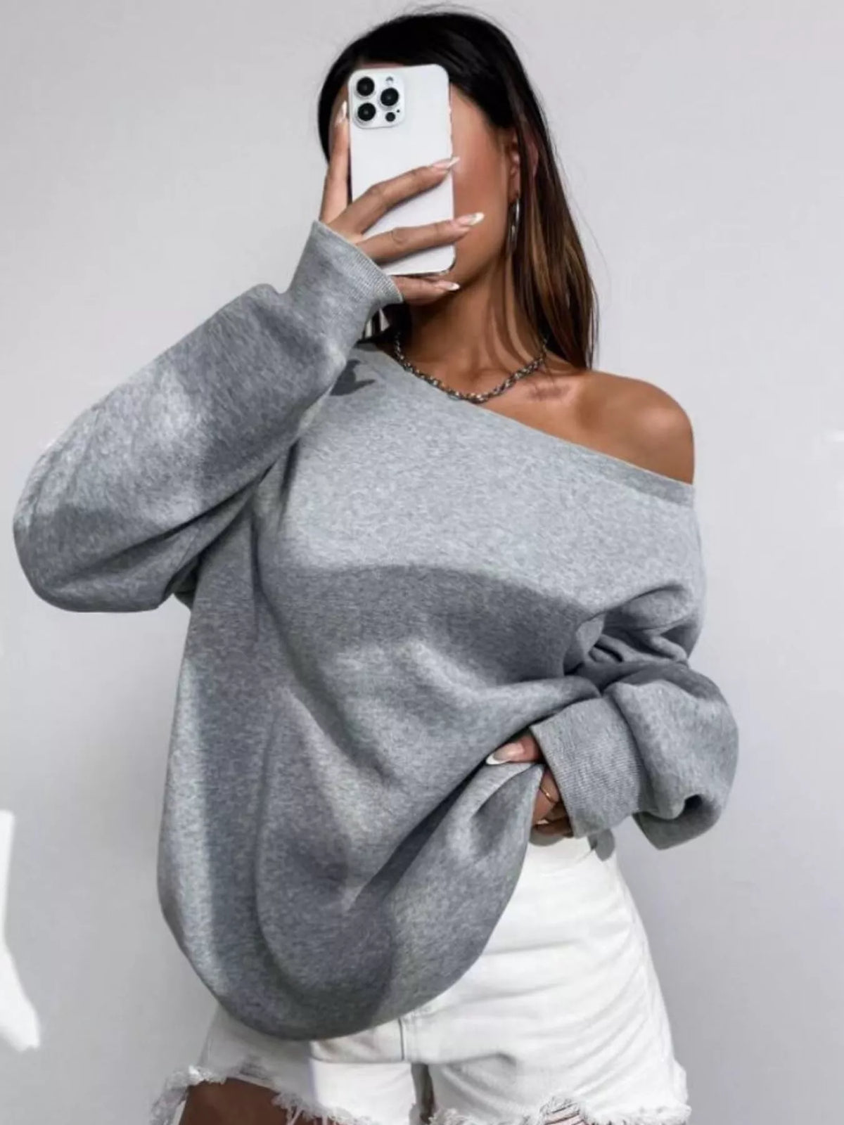Gray asymmetric-neck sweatshirt, front mirror view