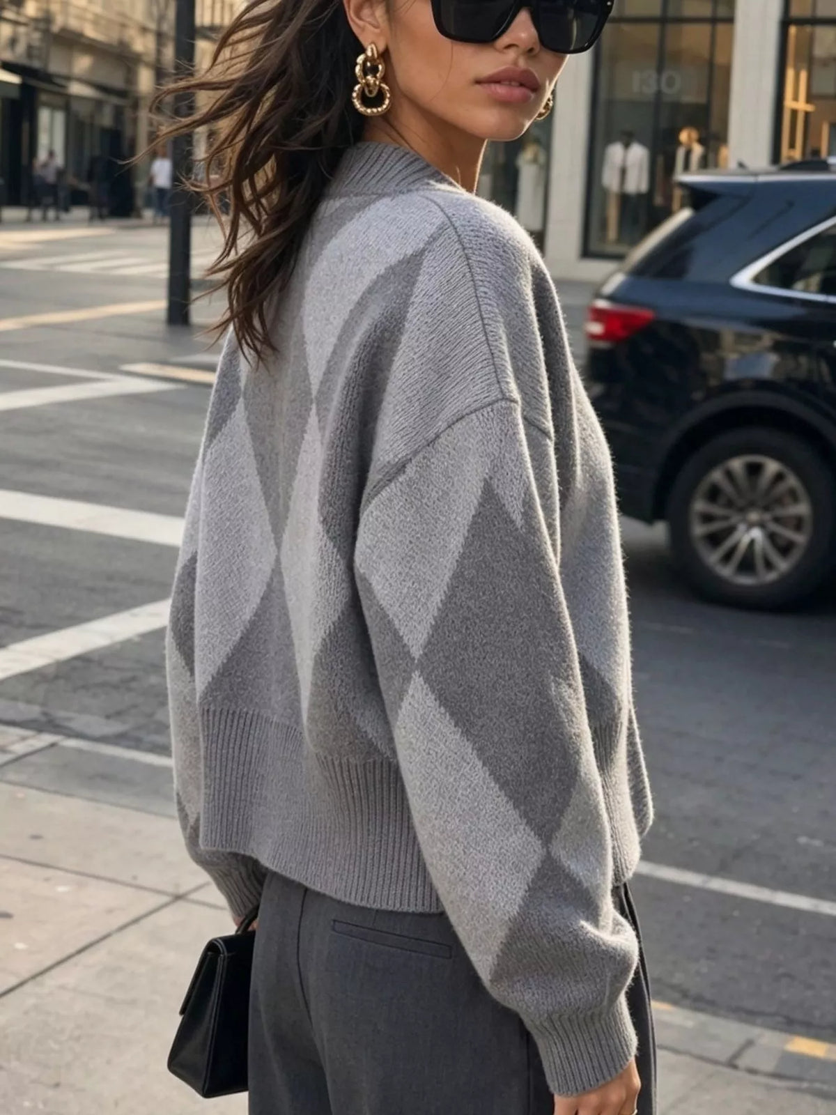 Gray argyle v-neck button-front cardigan, back view.