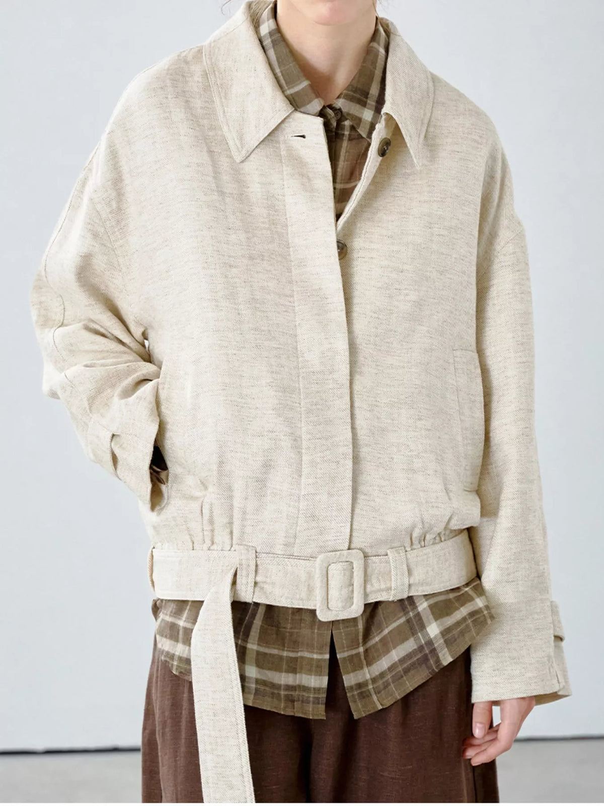 Cream belted dropped shoulder jacket — front view