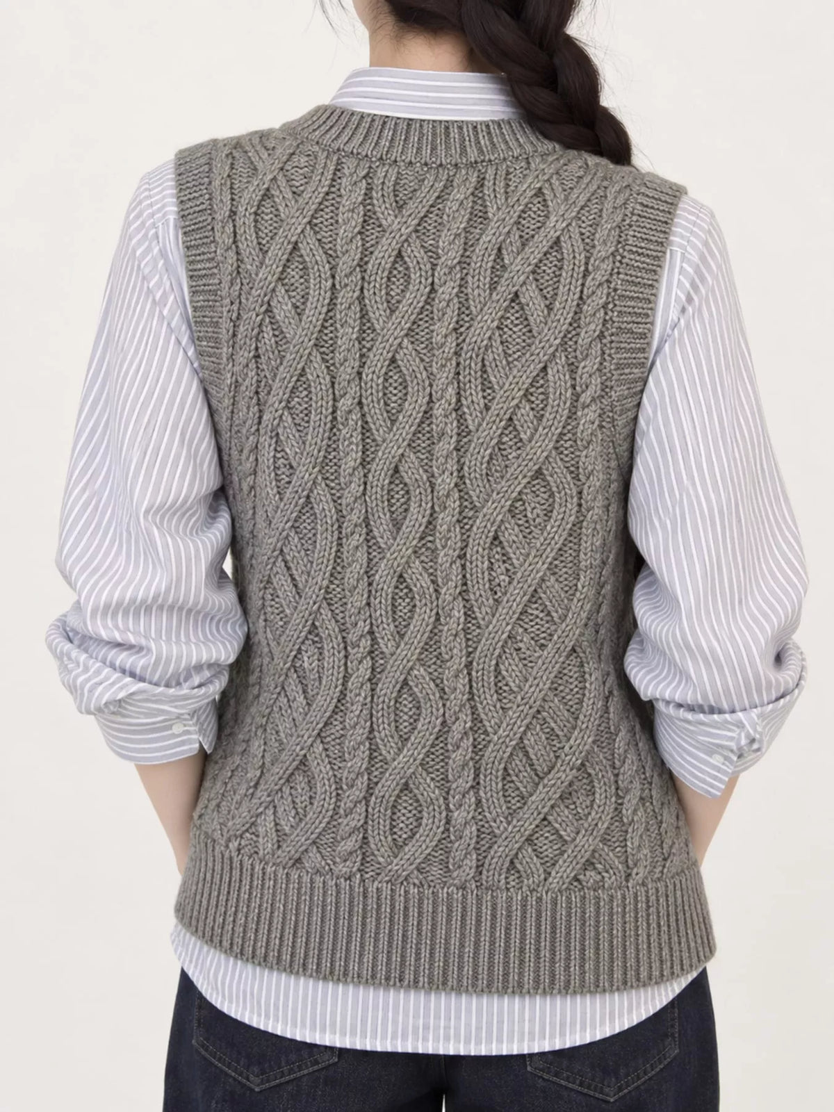 Gray cable-knit sweater vest, back view