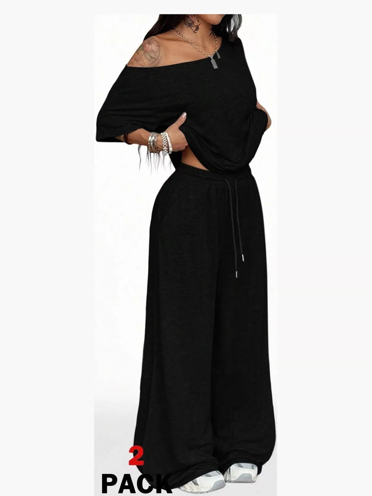 Black boat neck top and wide-leg pants set — front view