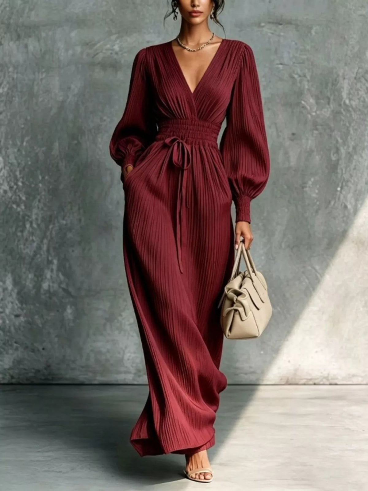 Burgundy pleated v-neck tie-waist maxi dress, full front view.