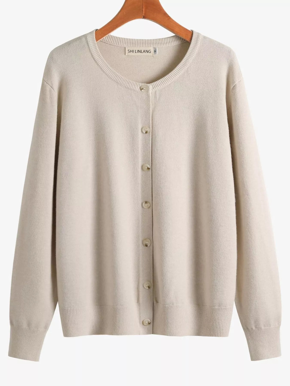 Cream crew neck button down knit cardigan, front view