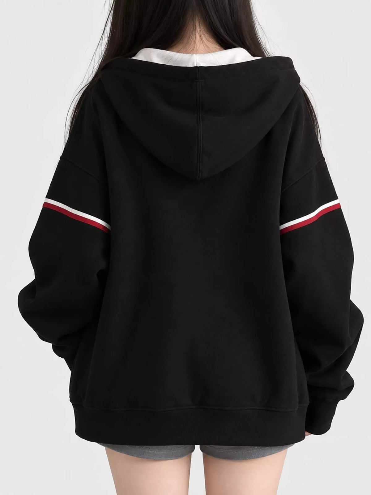 Oversized Zip-Up Hoodie with Striped Sleeves, back view in black