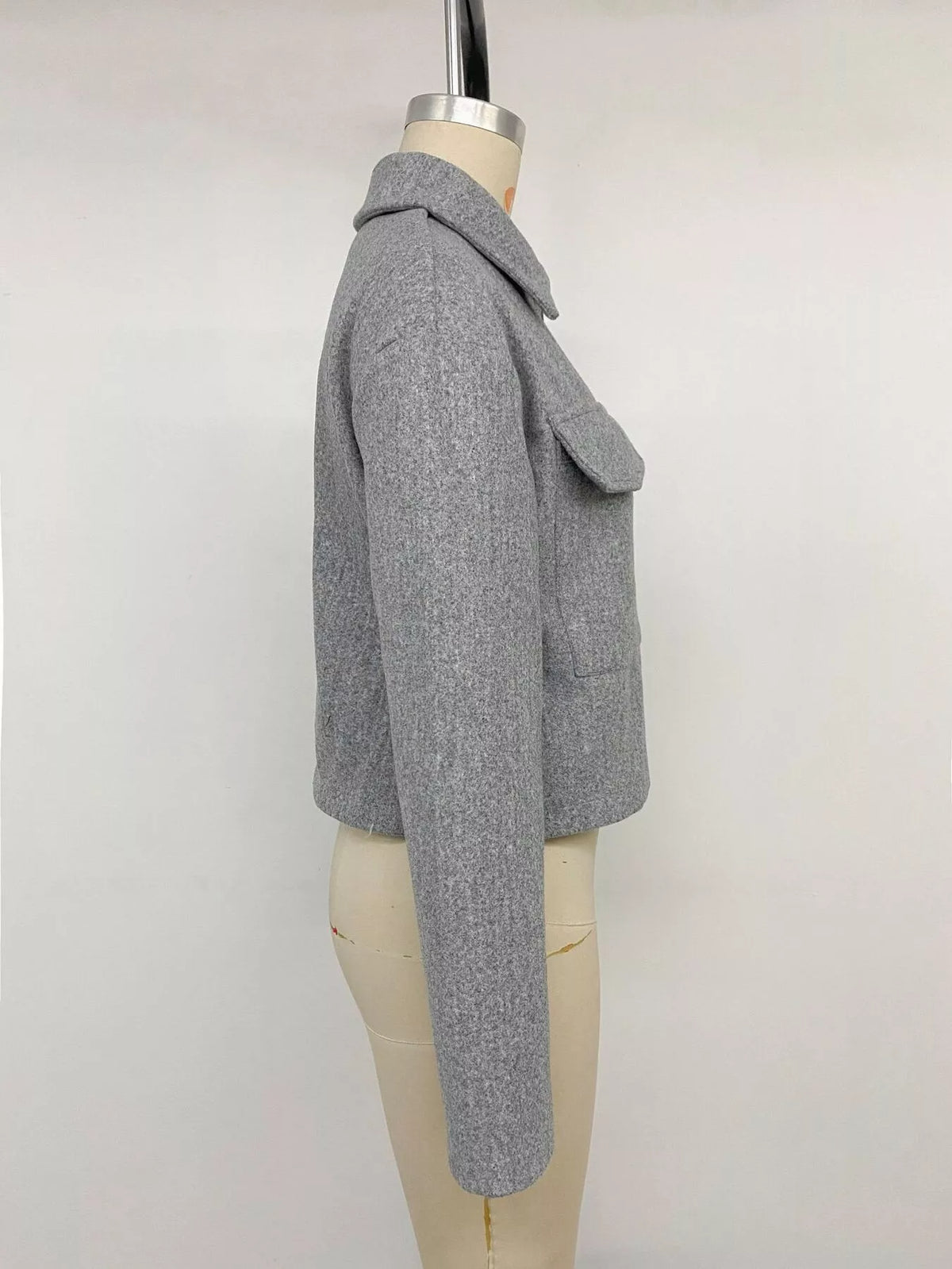 Gray zip-up cropped shacket, side on mannequin