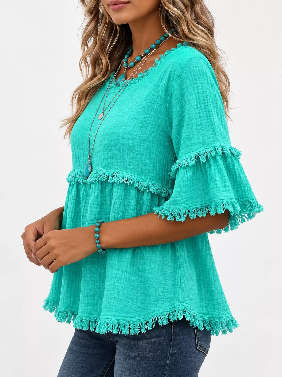 Turquoise frayed edge textured blouse, side view