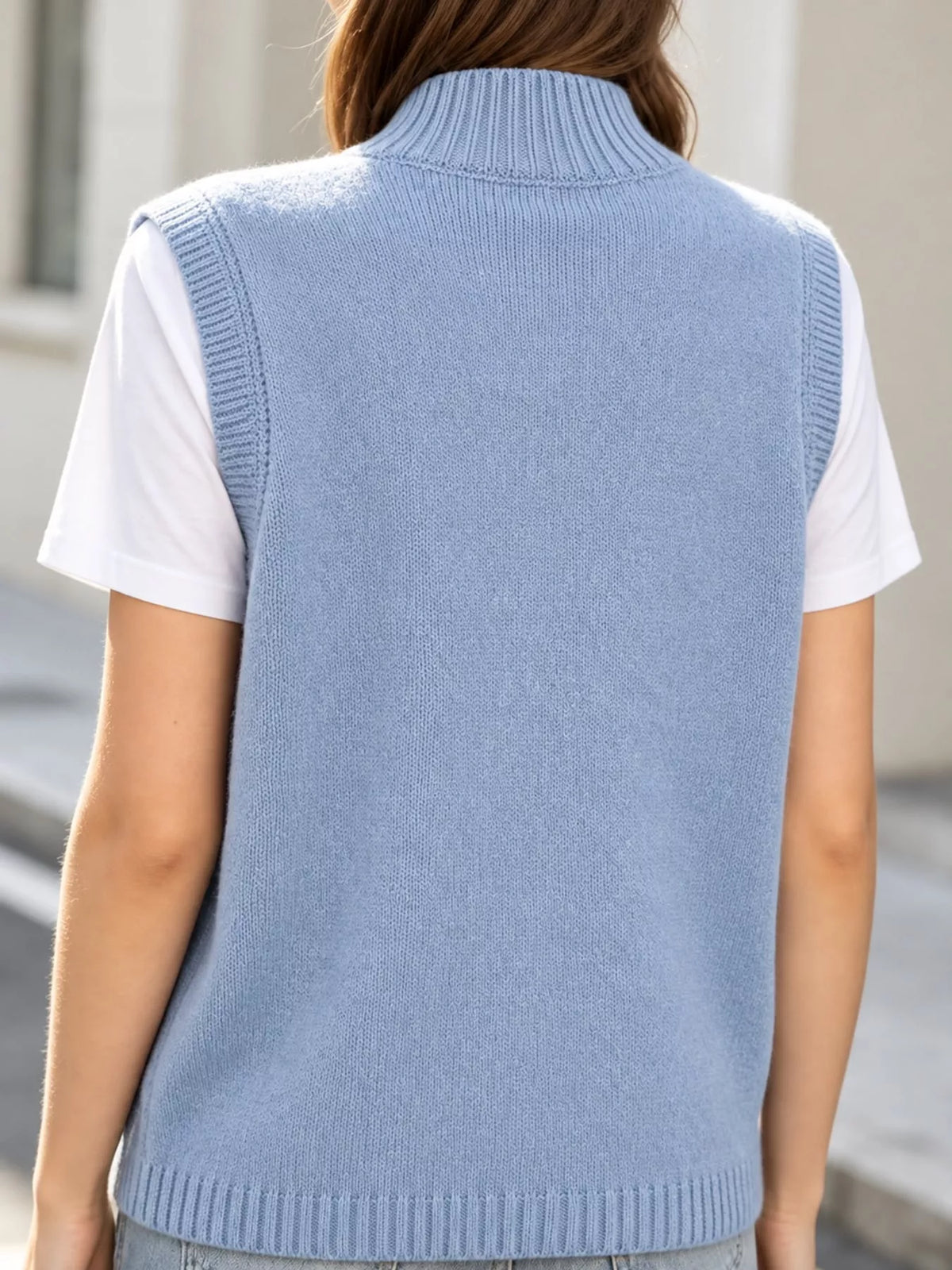Mock Neck Asymmetrical Hem Knit Sweater Vest, back view in light blue