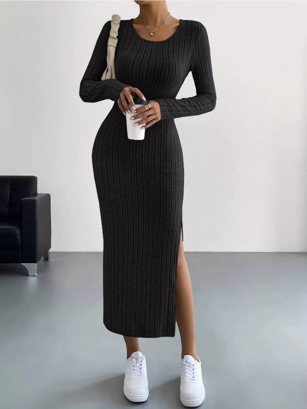 Black ribbed long sleeve knit dress with side slit
