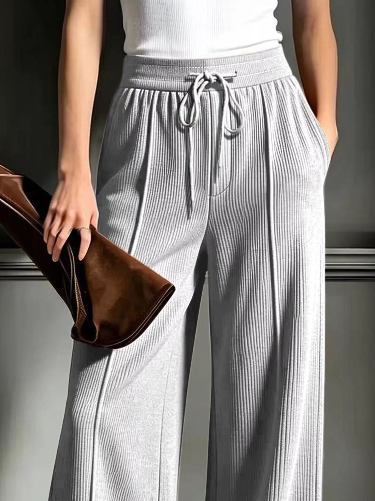 Gray wide-leg ribbed corduroy pants, drawstring waistband and side pockets