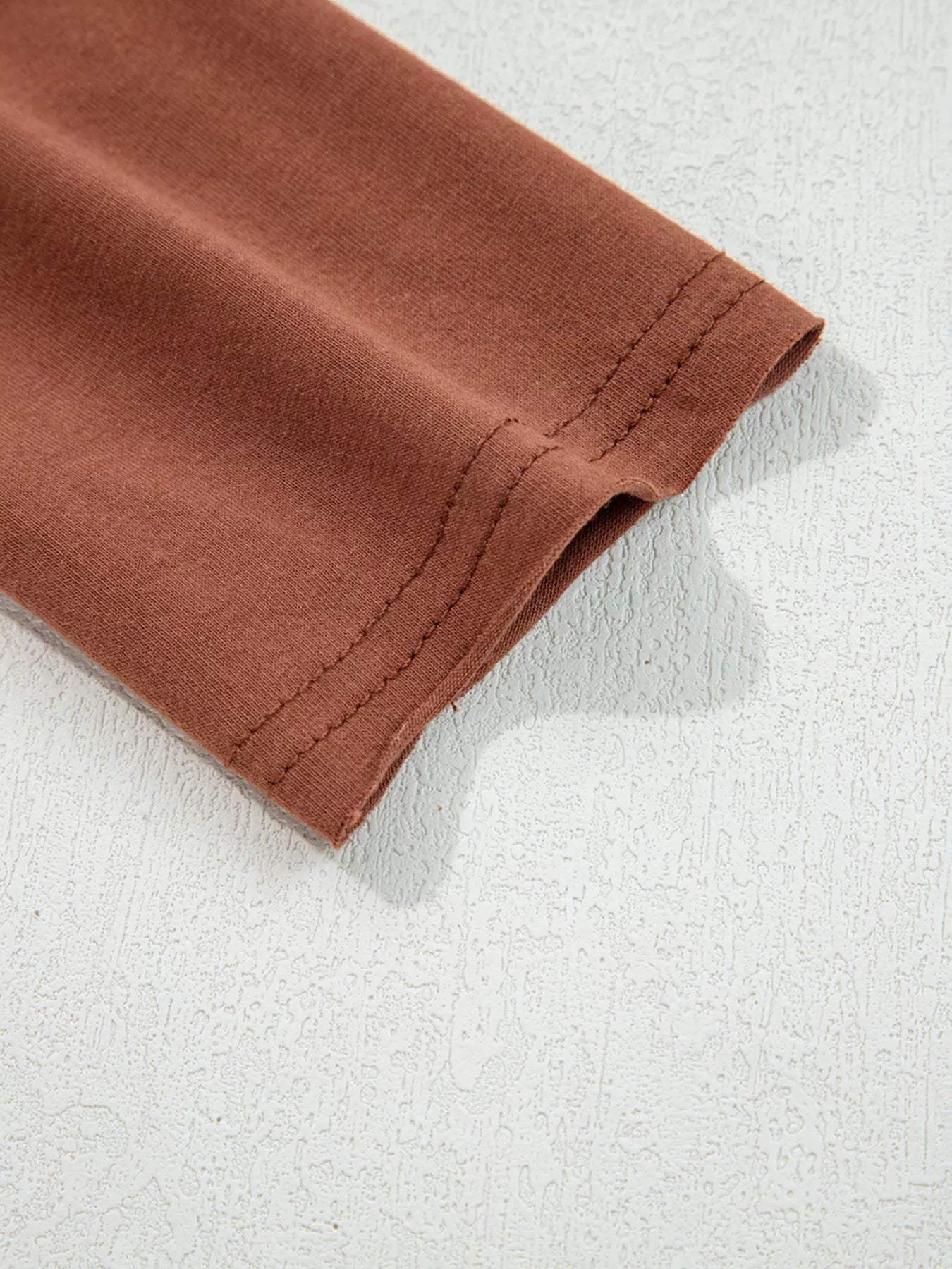 Trendsi Raw Seam Detail Solid Color Long Sleeve Top -