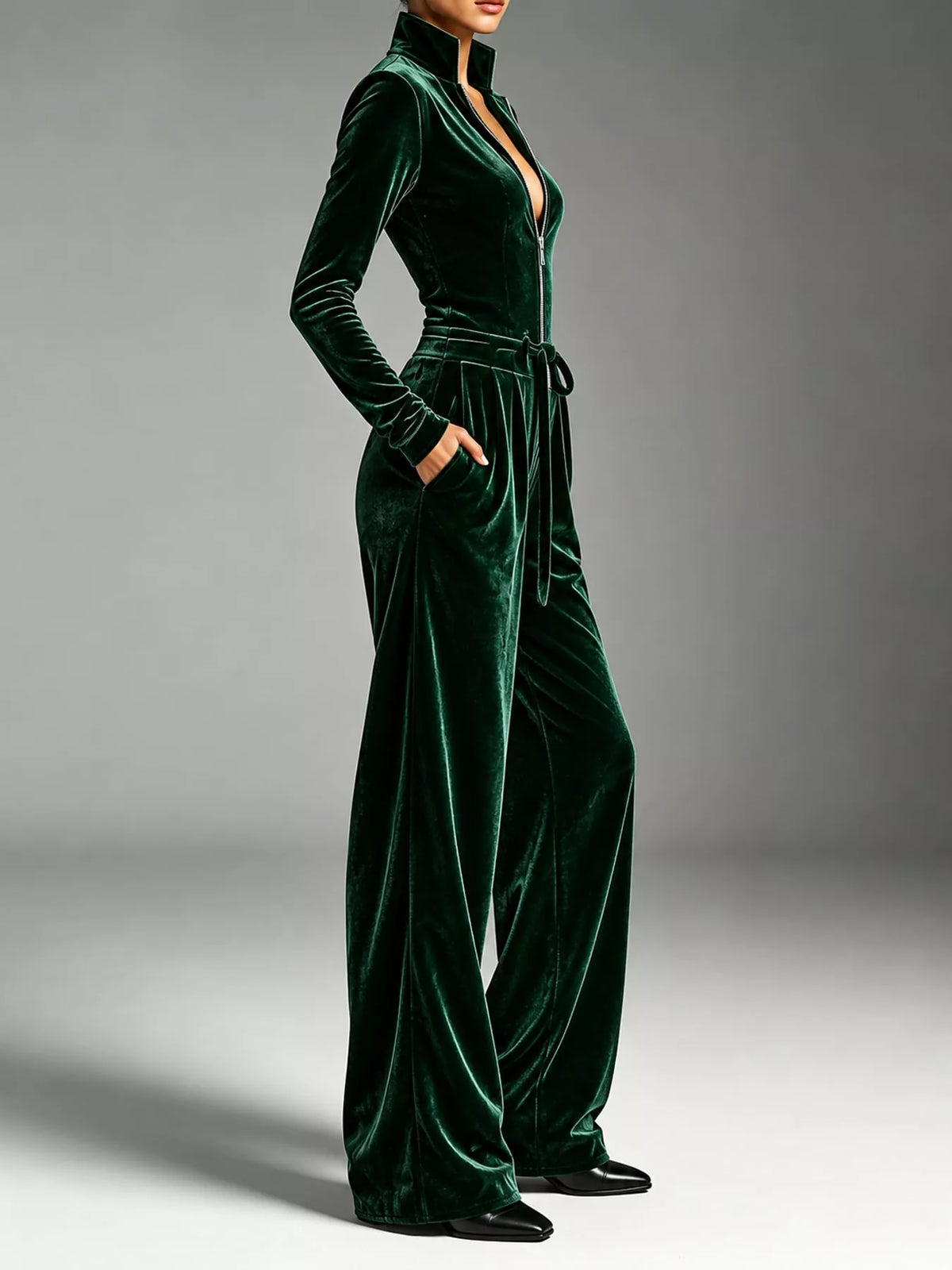 Green velvet zip up jumpsuit with tie waist, side view