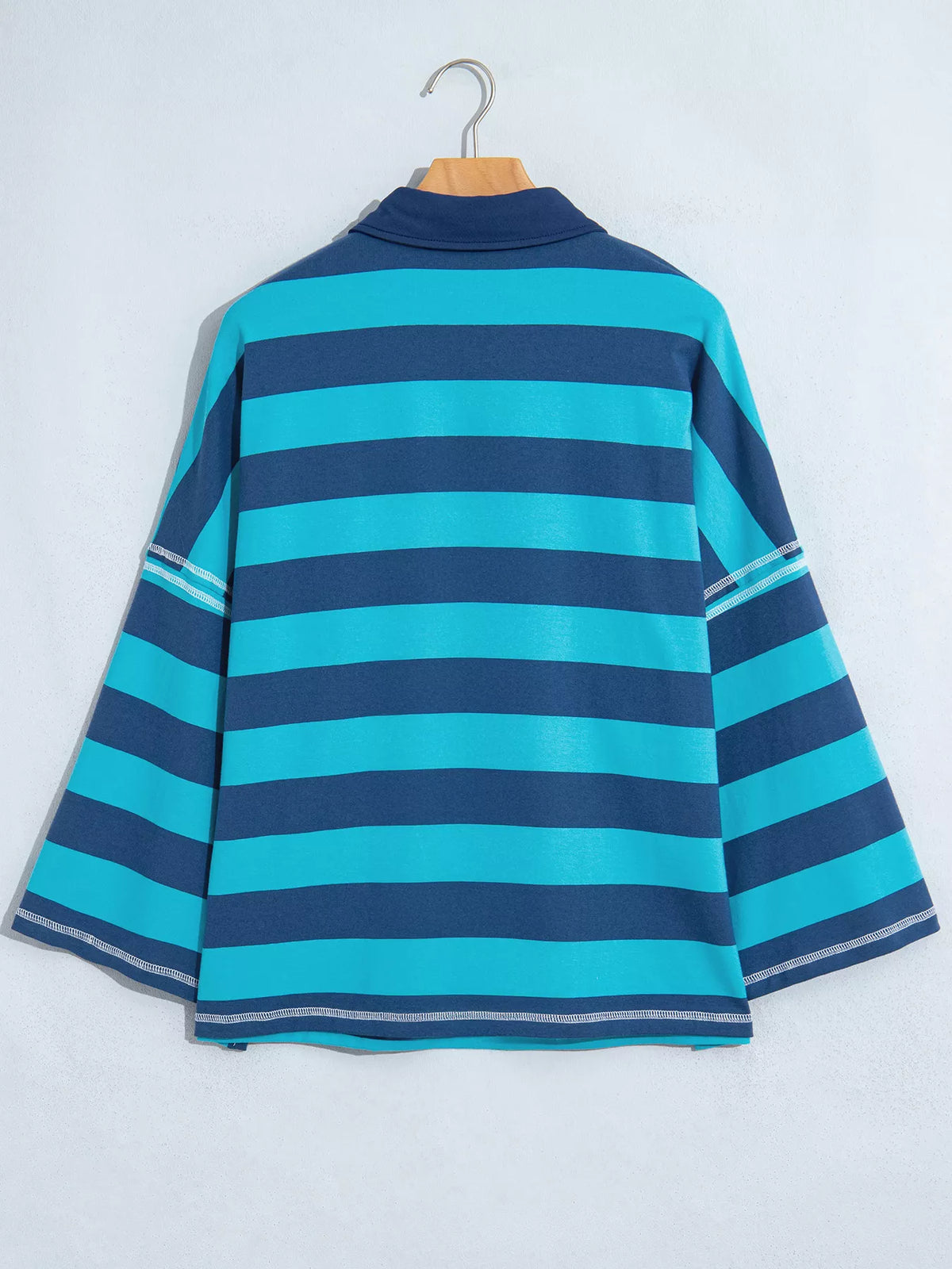 Striped polo top, hanging back