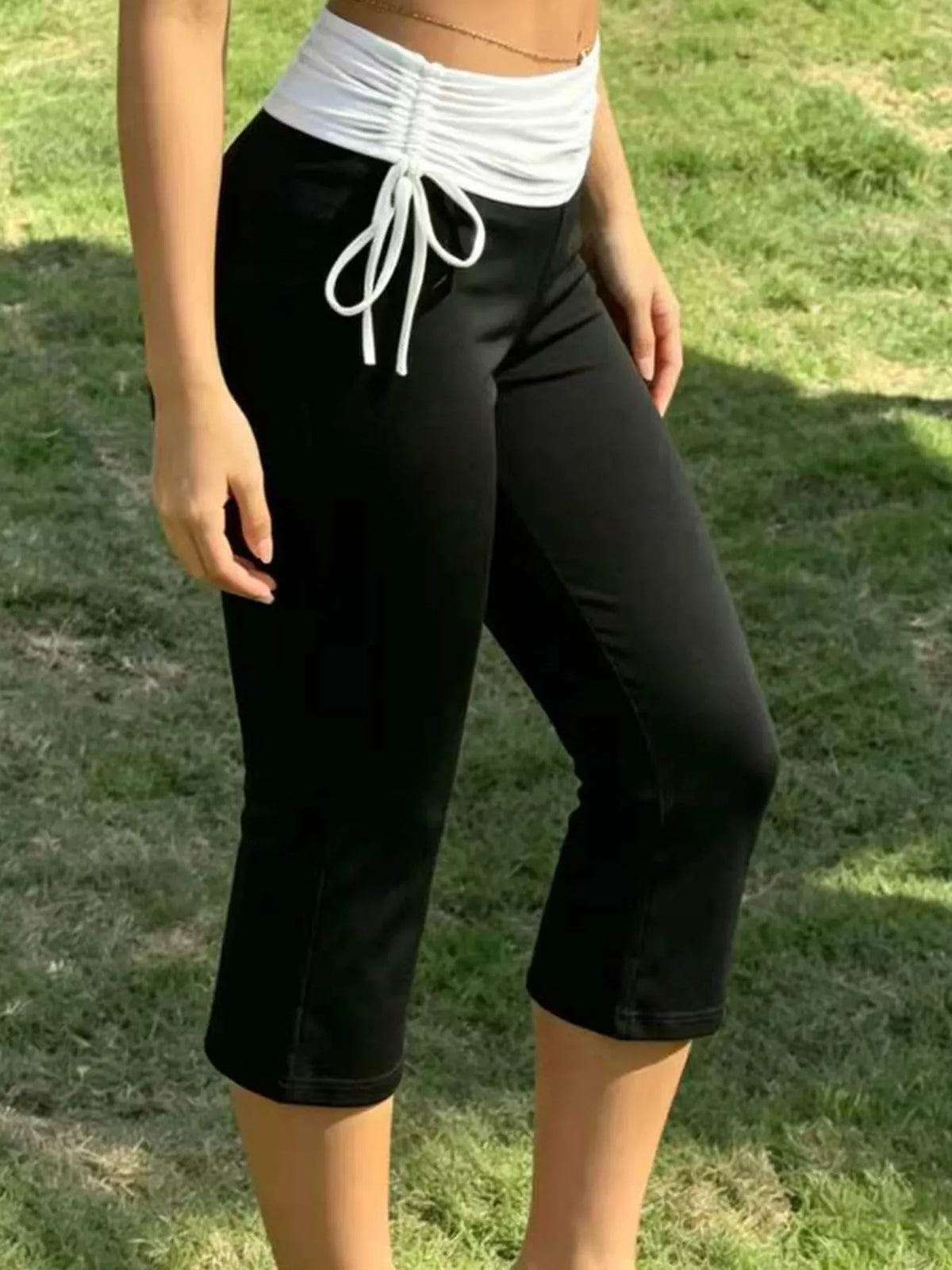 High-Waisted Ruched Drawstring Capri Pants in black and white, front view