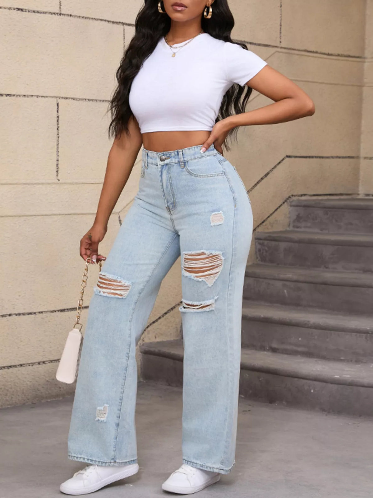 Light blue distressed wide-leg jeans, full front view at an angle