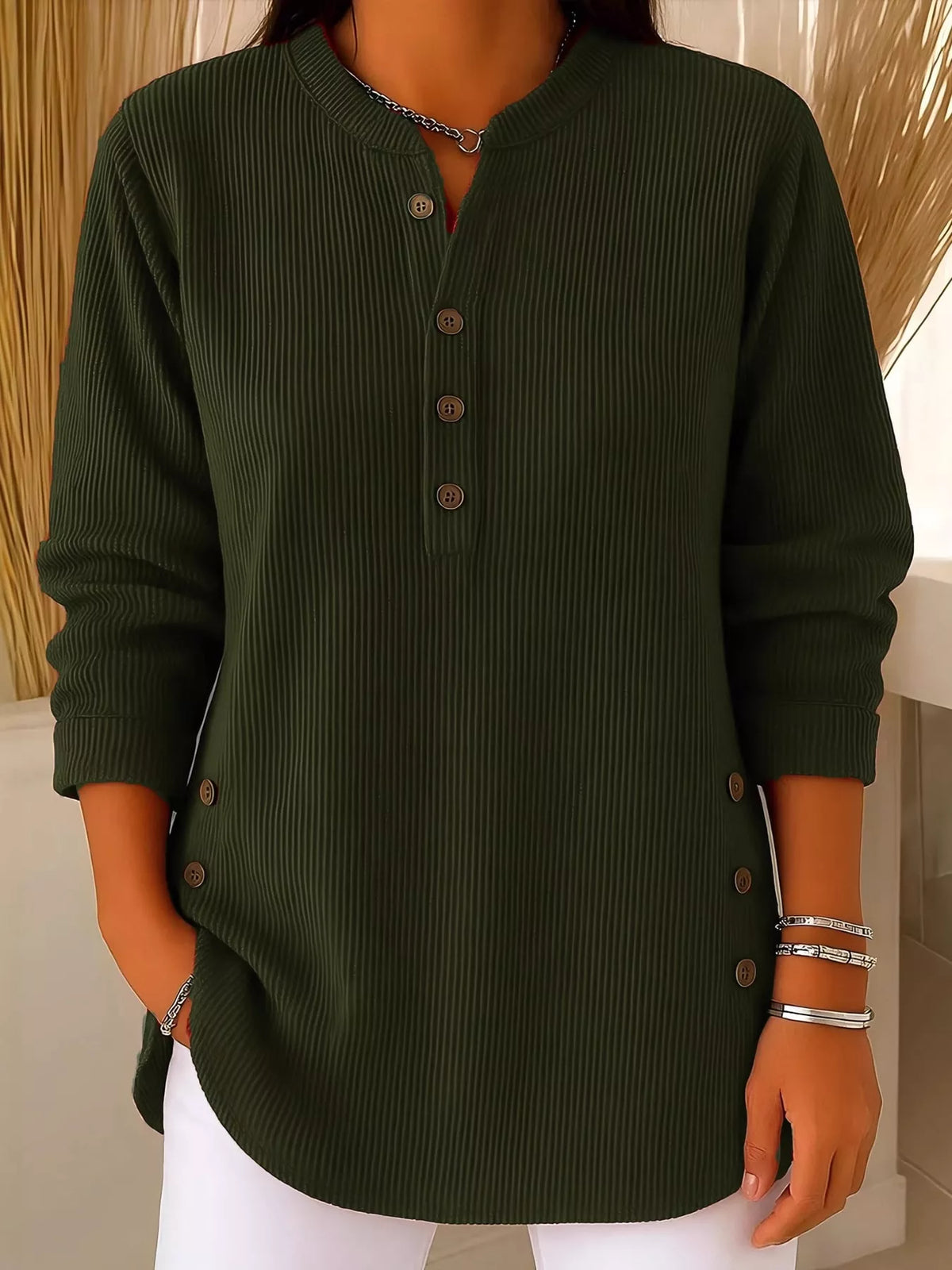 Green button detail long sleeve top, front view