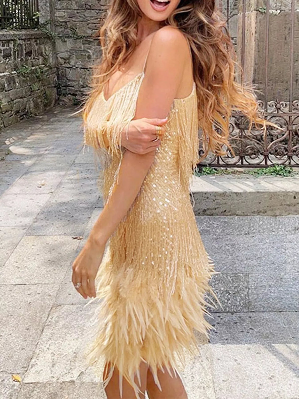 Gold feather fringe sequin mini dress, side view