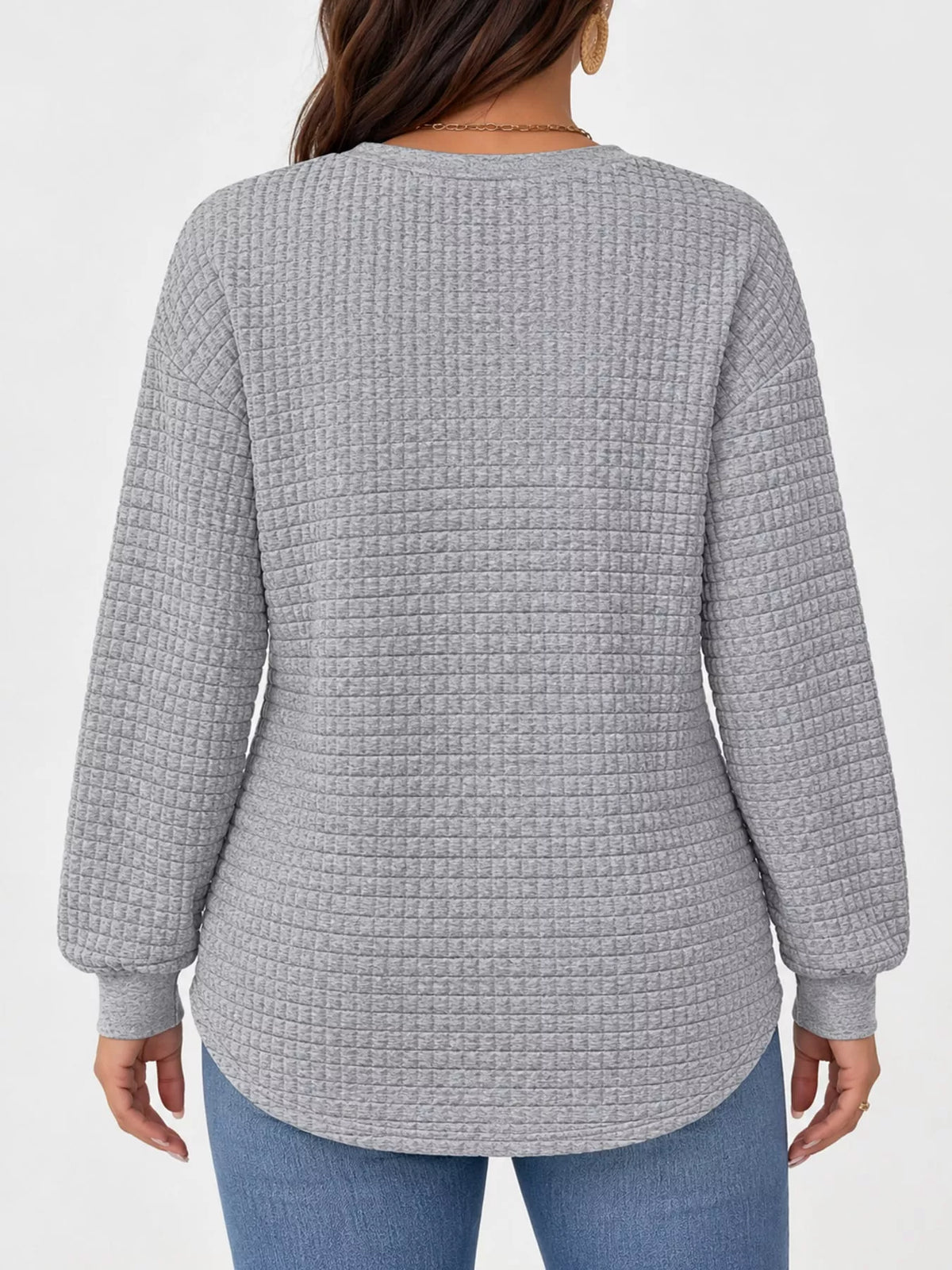 Gray waffle knit sweatshirt with curved hem, back view