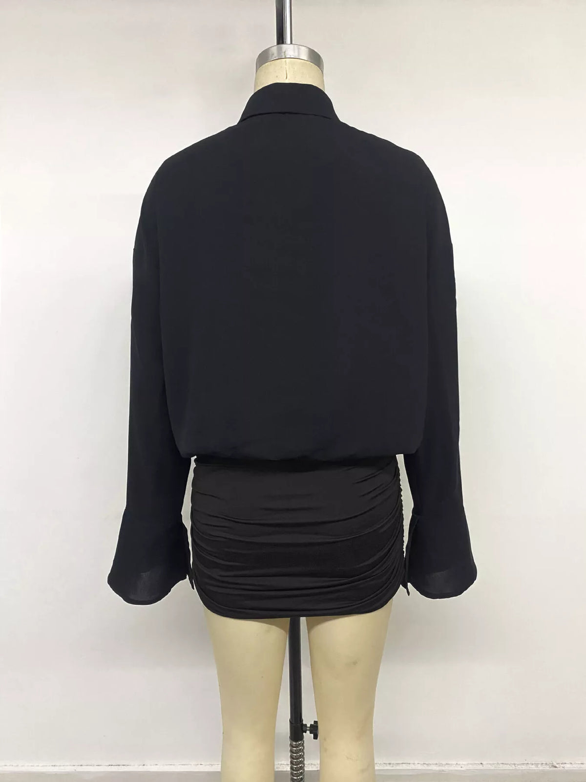 Black flounce sleeve ruched mini shirt dress, back on mannequin