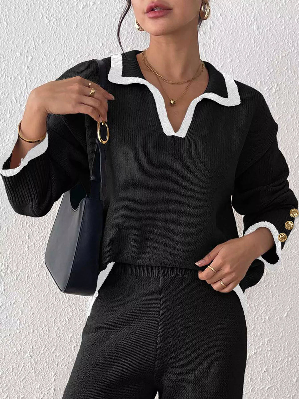 Black contrast-trim polo collar sweater, button cuff view