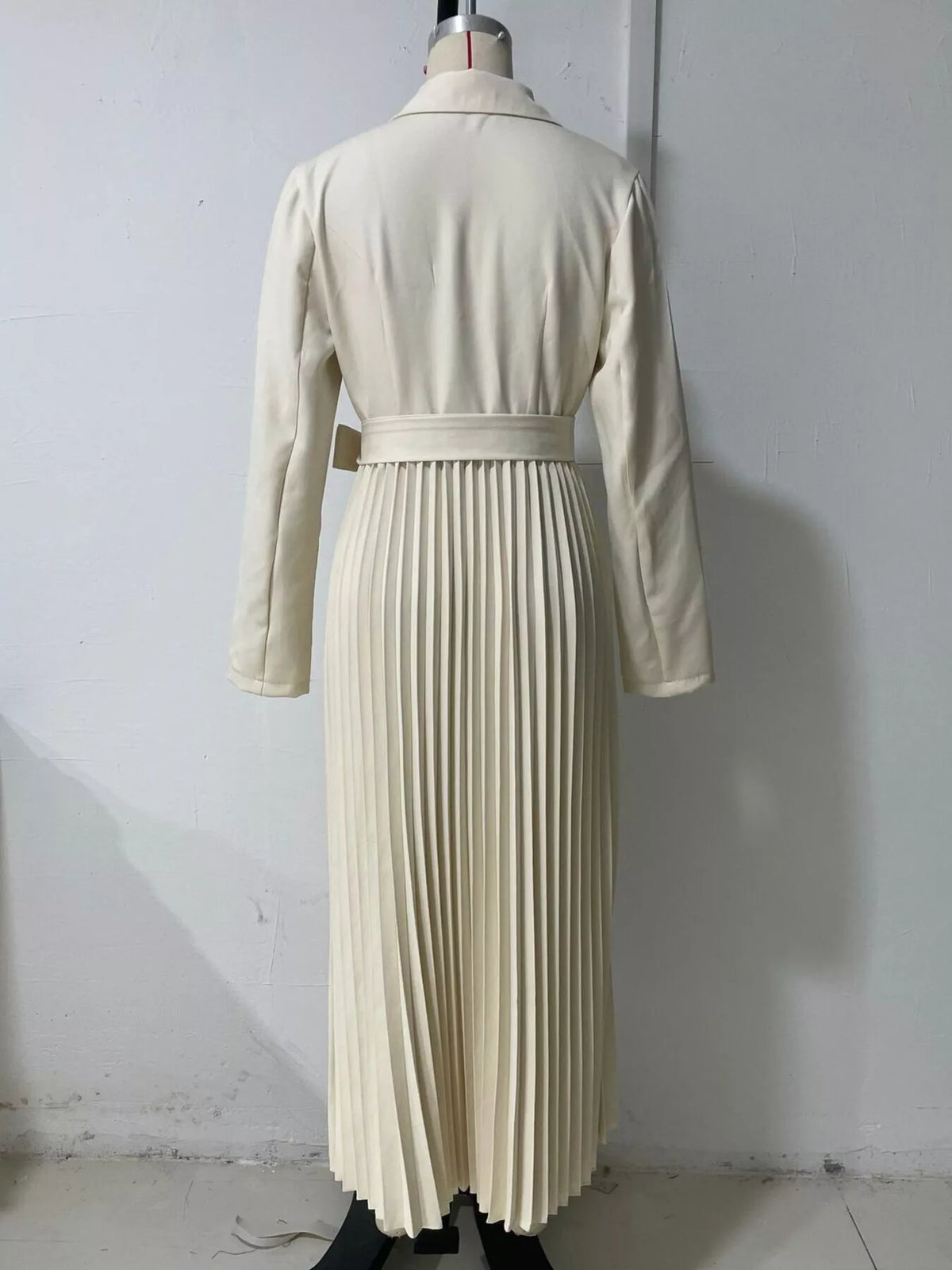 Beige belted blazer-style pleated midi dress, back on dress form