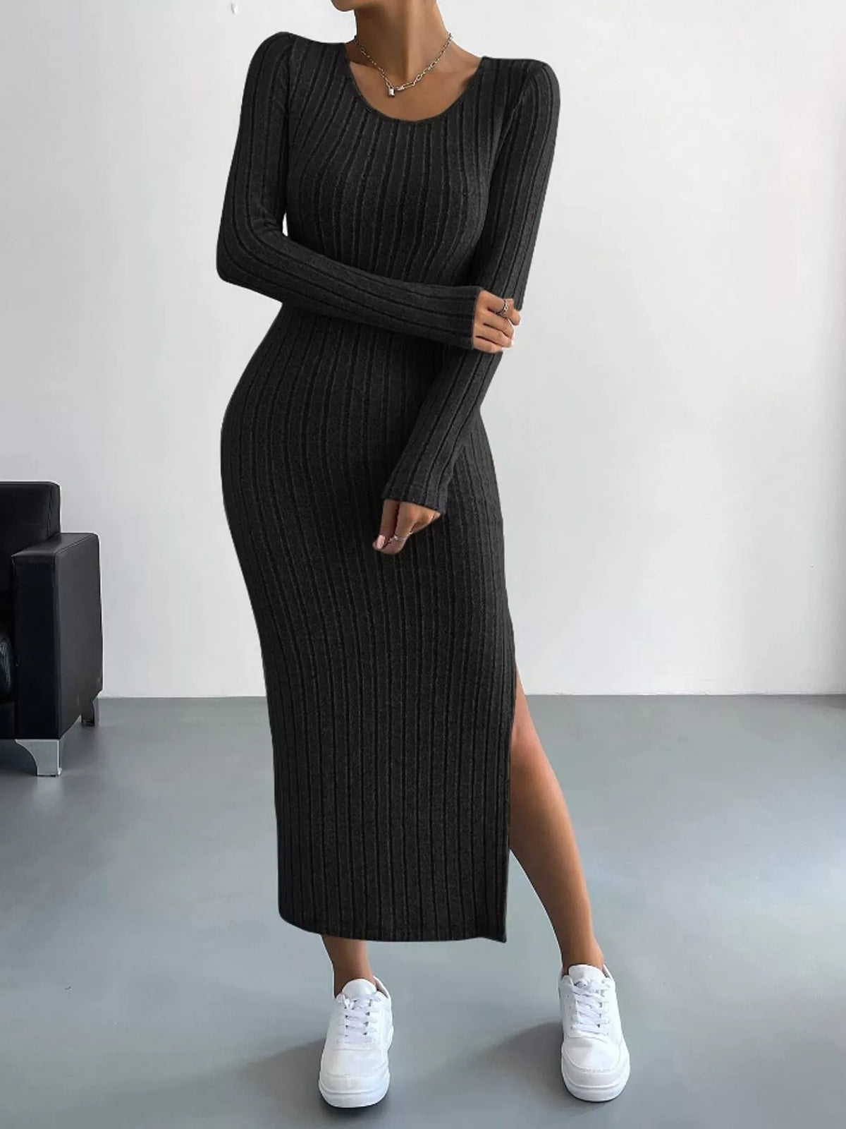 Black ribbed long sleeve knit dress with side slit