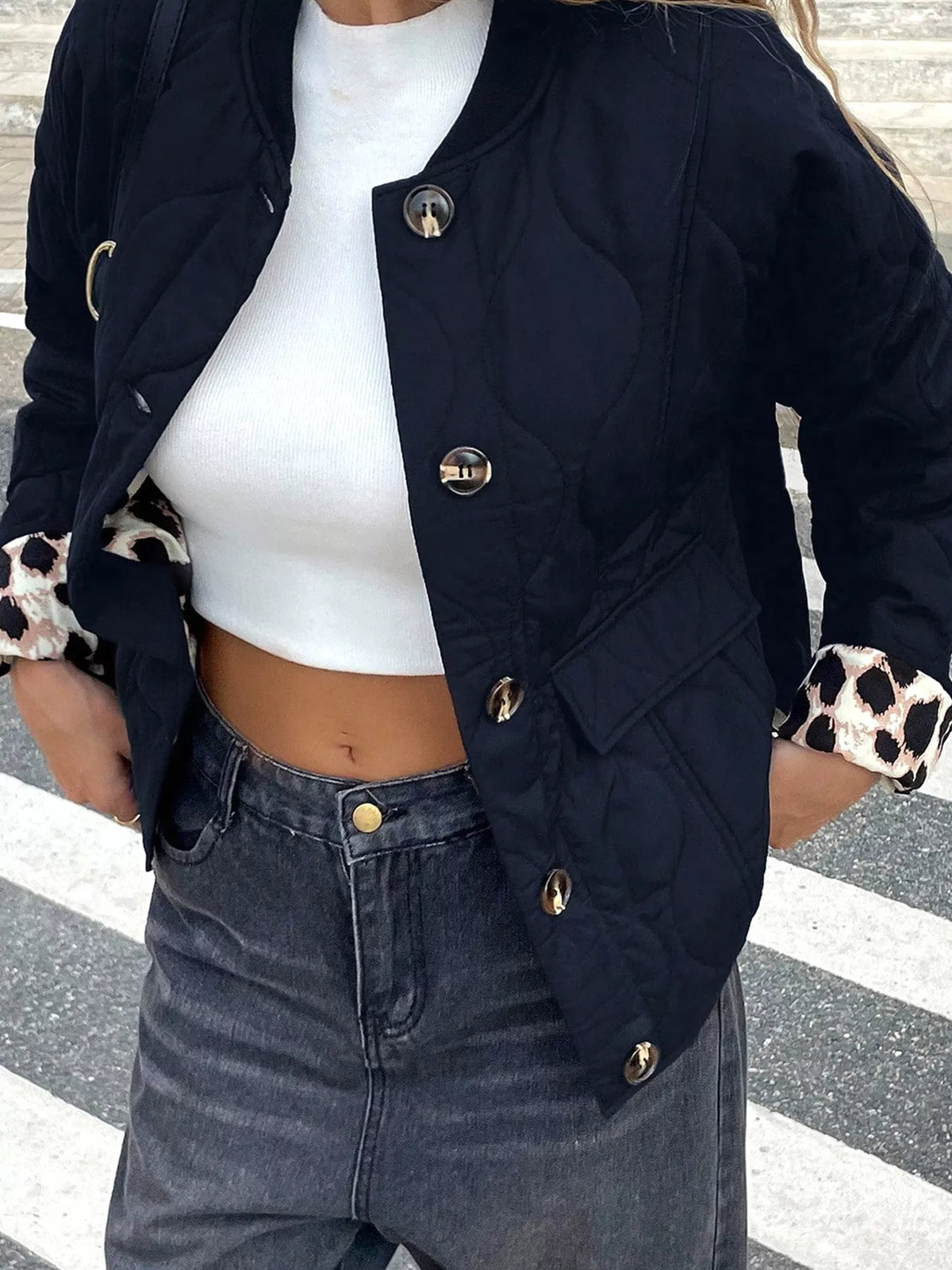 Quilted Leopard Cuff Button Down Puffer Jacket in black, front view