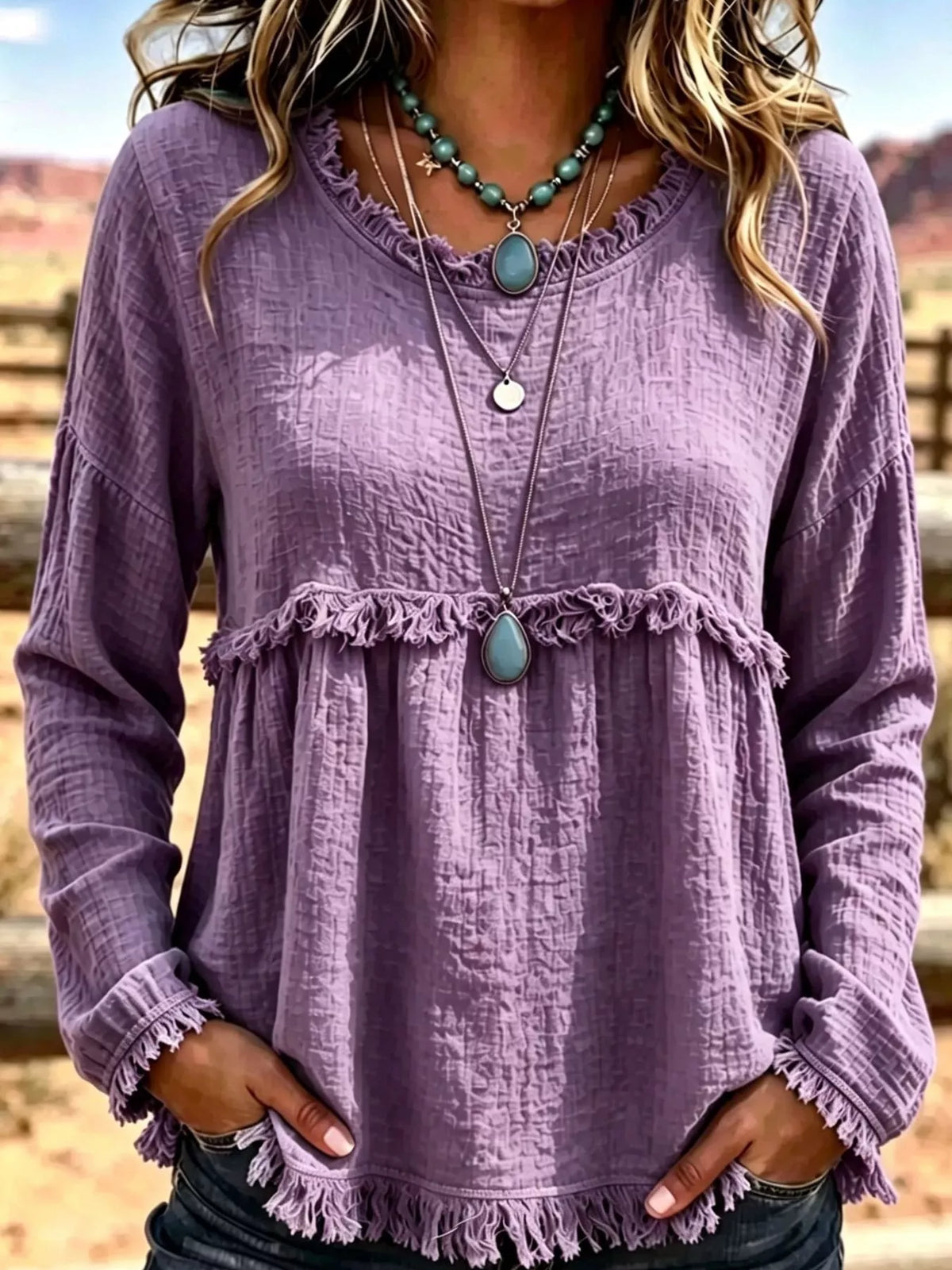 Purple frayed hem textured blouse, front view