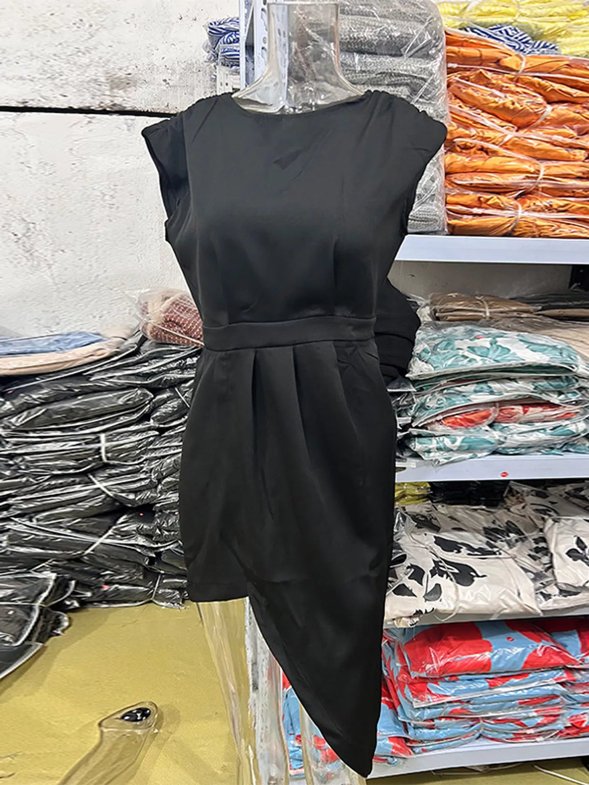 Women's Asymmetrical Backless Pleated Dress in black — flat lay view