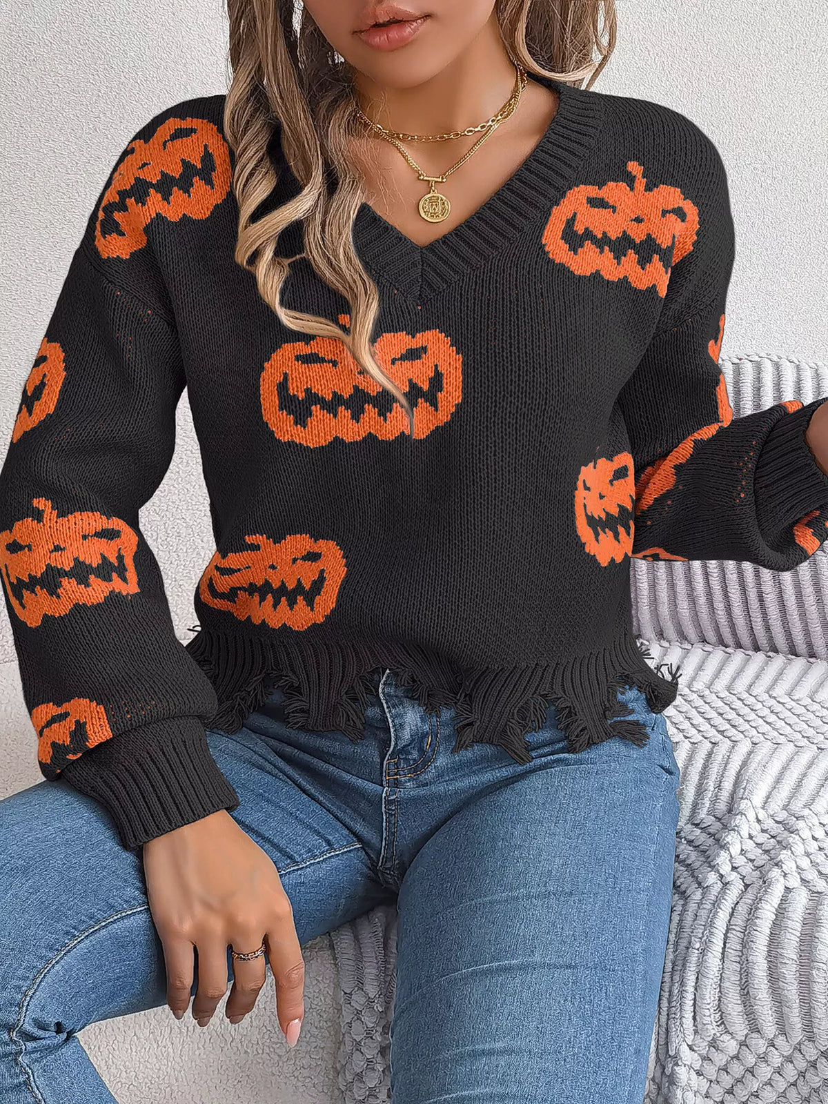 Pumpkin Distressed Hem Sweater in black, front view
