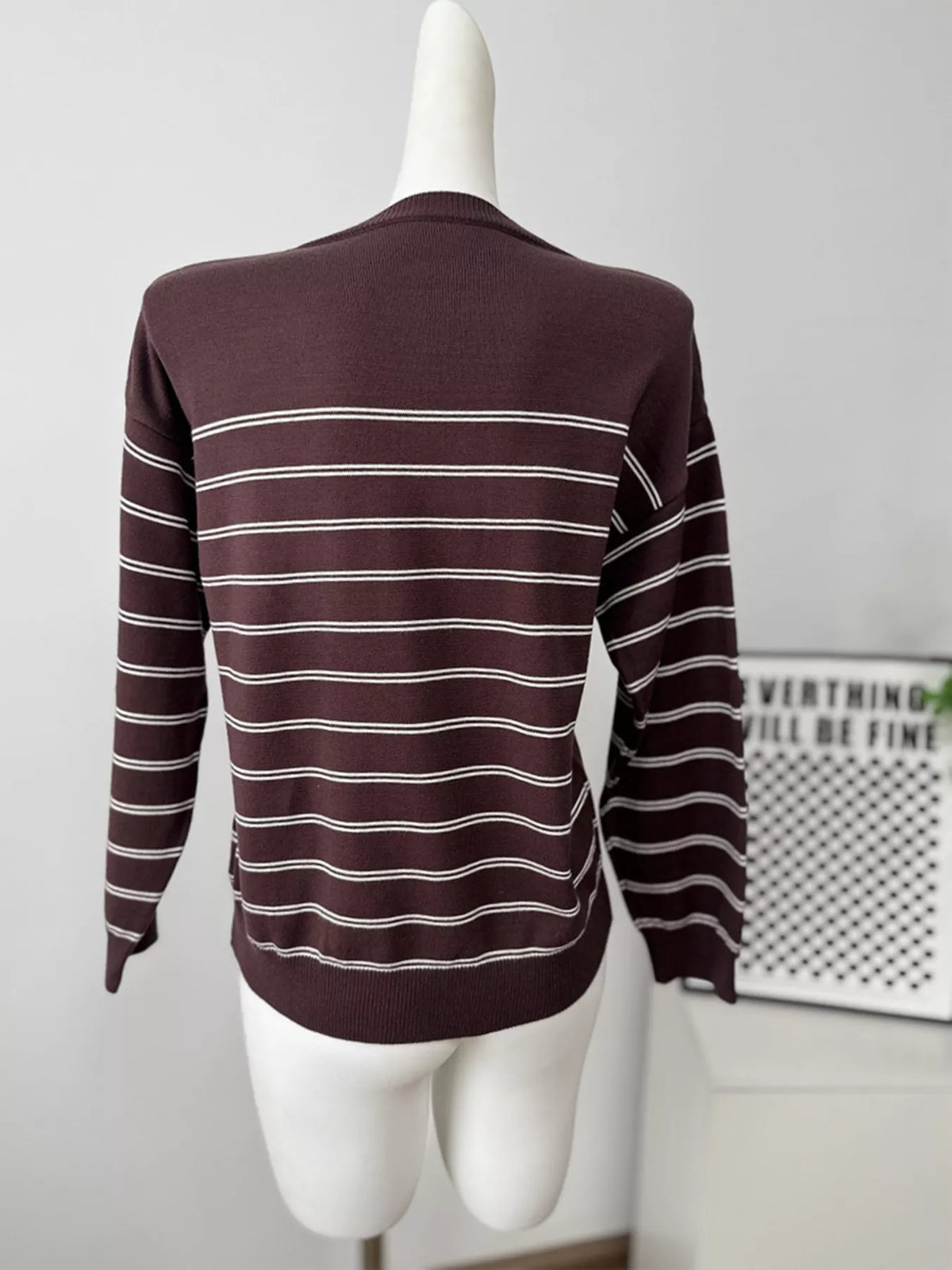 Striped crewneck sweater with layered tie detail in brown, back mannequin view without layer