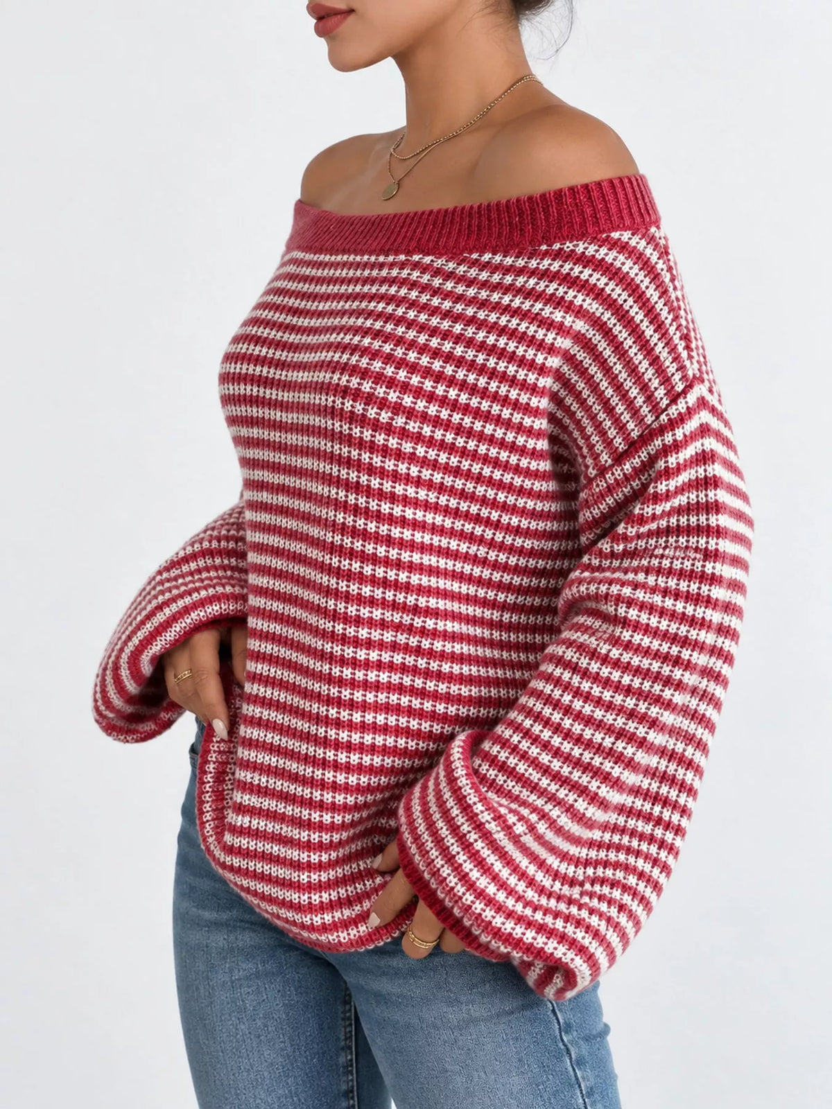 Red and white striped knit boat neck sweater, side view