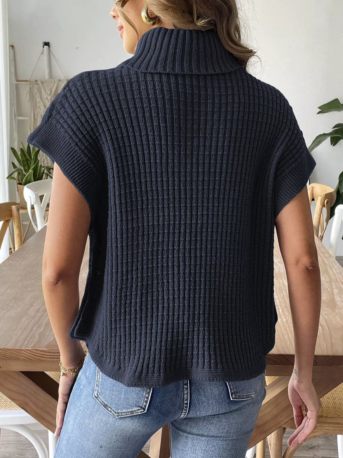 Navy ribbed turtleneck side-button sweater, back view.