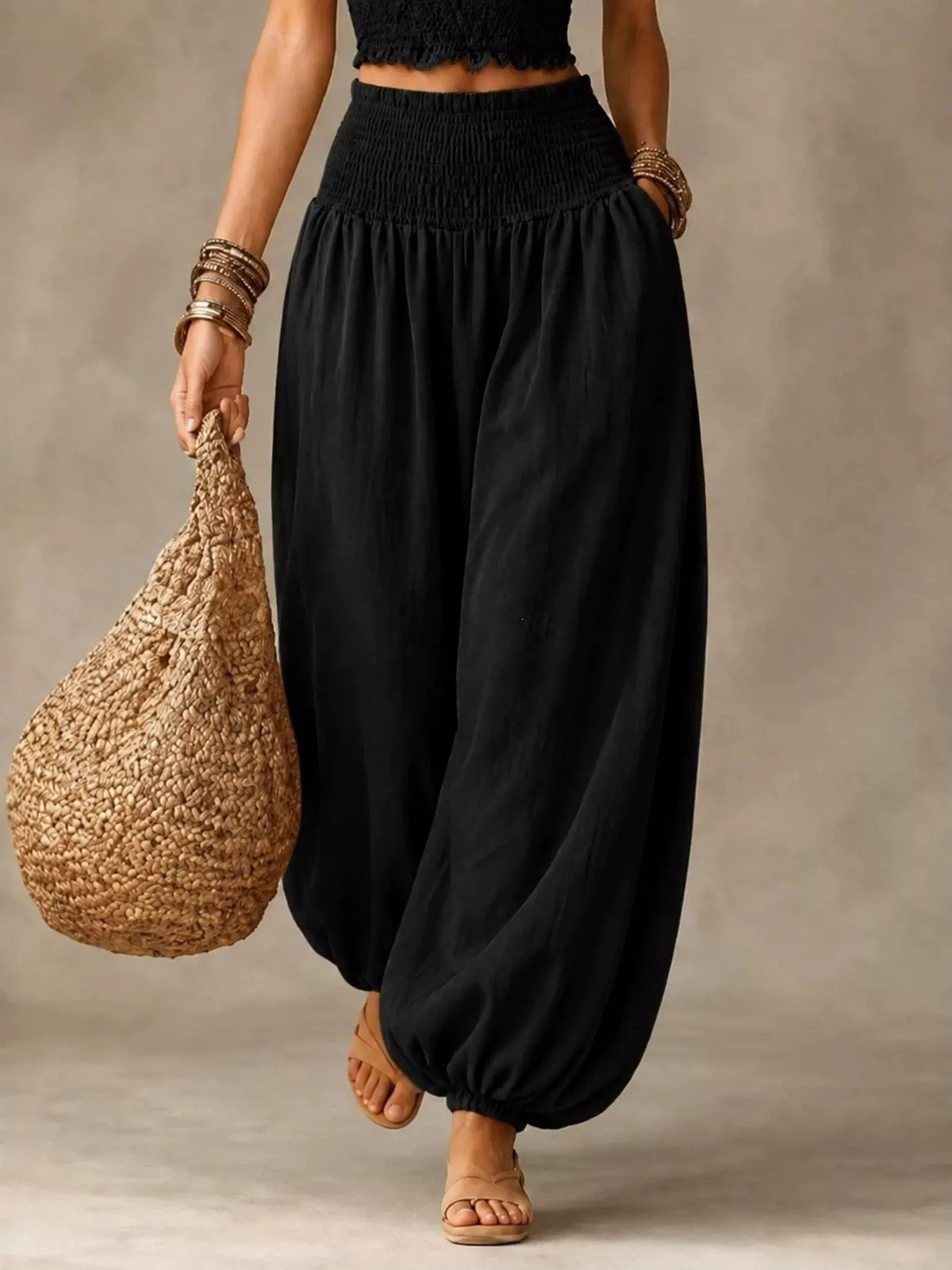 Women's Smocked Harem Pants in black — front view