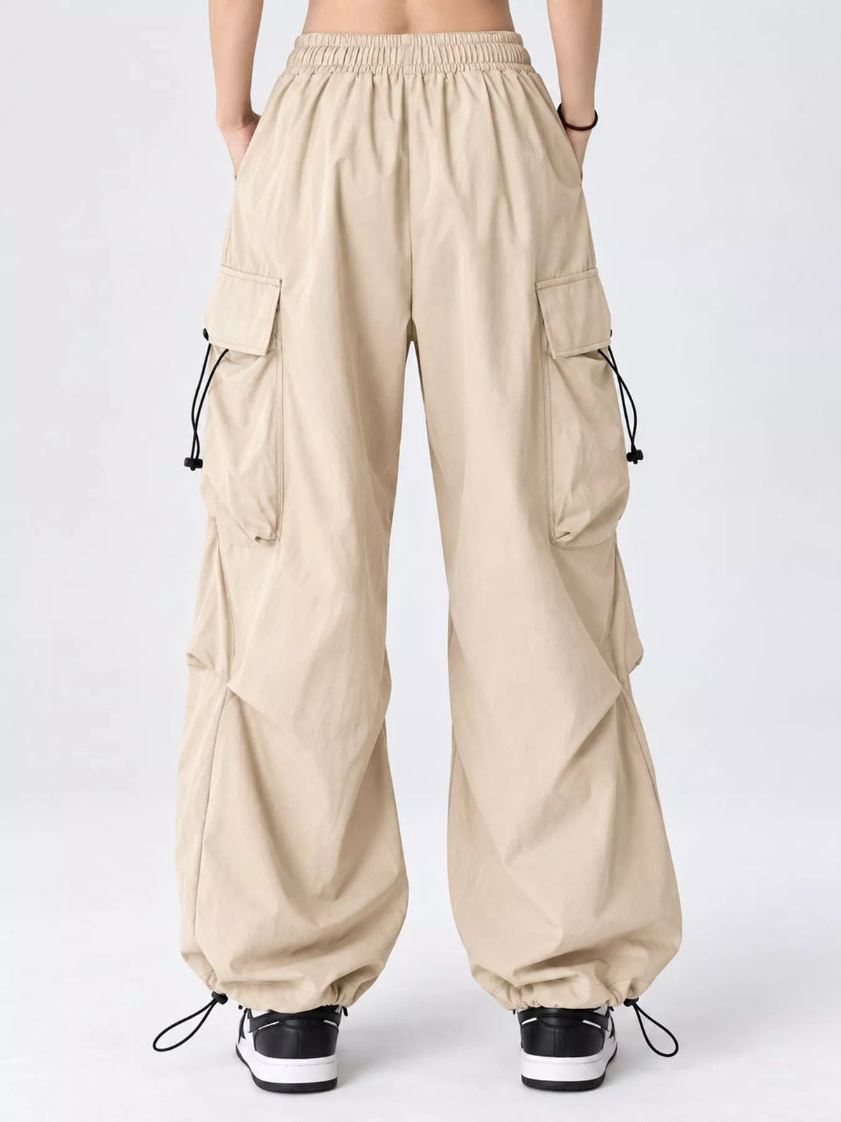 Beige drawstring cargo pants, back view