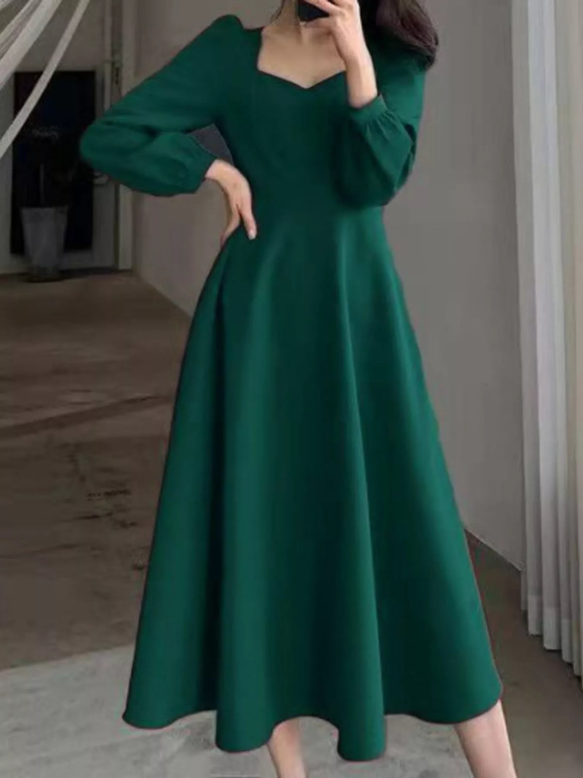 Green long sleeve a line midi dress, front view