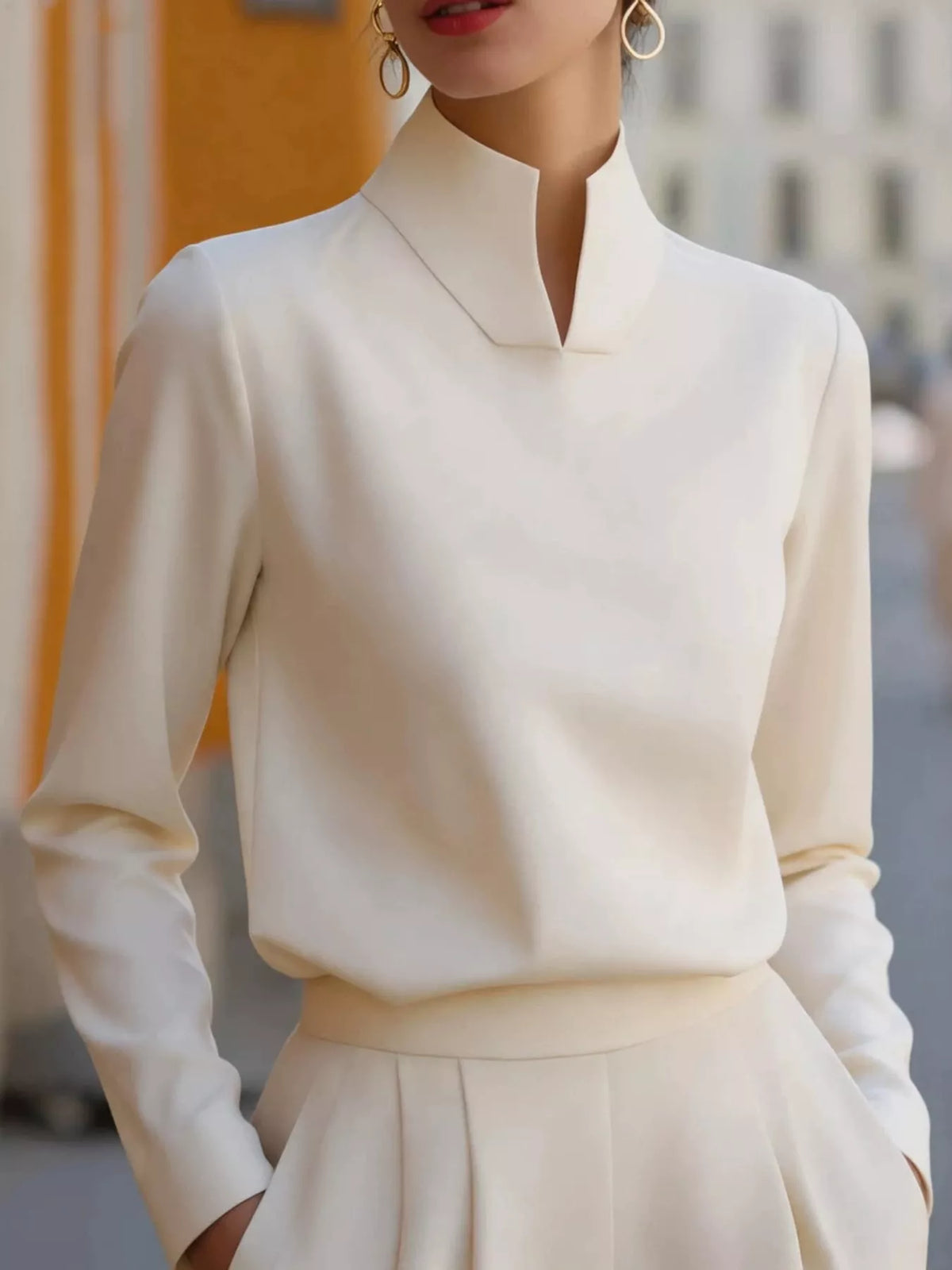 Mandarin neck long sleeve blouse, front view on model